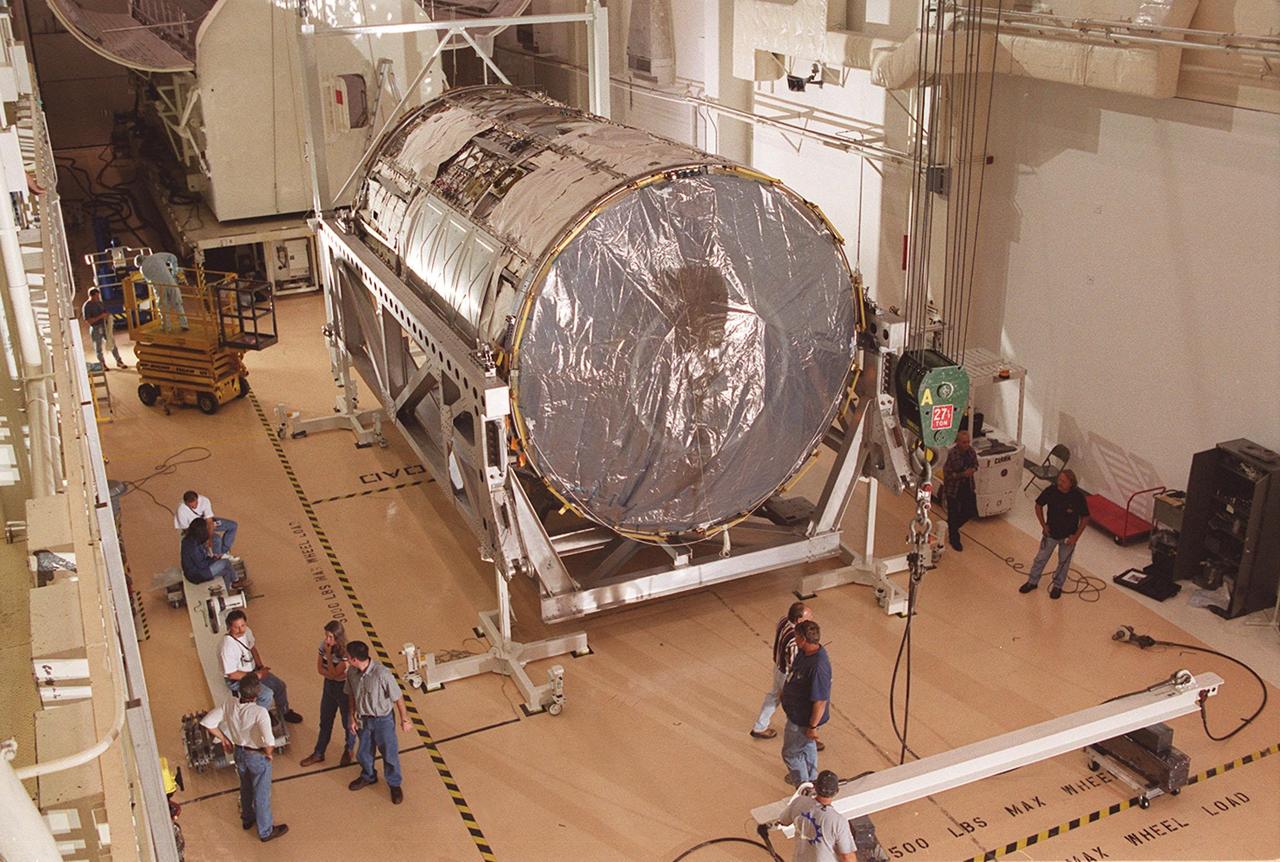 KENNEDY SPACE CENTER, FLA -- In the Operations and Checkout Building (O&C), the U.S. Lab, a component of the International Space Station, sits on a rotation and handling fixture before being raised to vertical. The Lab, named Destiny, will undergo testing in the altitude chamber in the O&C. Destiny is scheduled to fly on mission STS-98 in early 2001. During the mission, the crew will install the Lab in the Space Station during a series of three space walks. The STS-98 mission will provide the Station with science research facilities and expand its power, life support and control capabilities. The U.S. Lab module continues a long tradition of microgravity materials research, first conducted by Skylab and later Shuttle and Spacelab missions. Destiny is expected to be a major feature in future research, providing facilities for biotechnology, fluid physics, combustion, and life sciences research