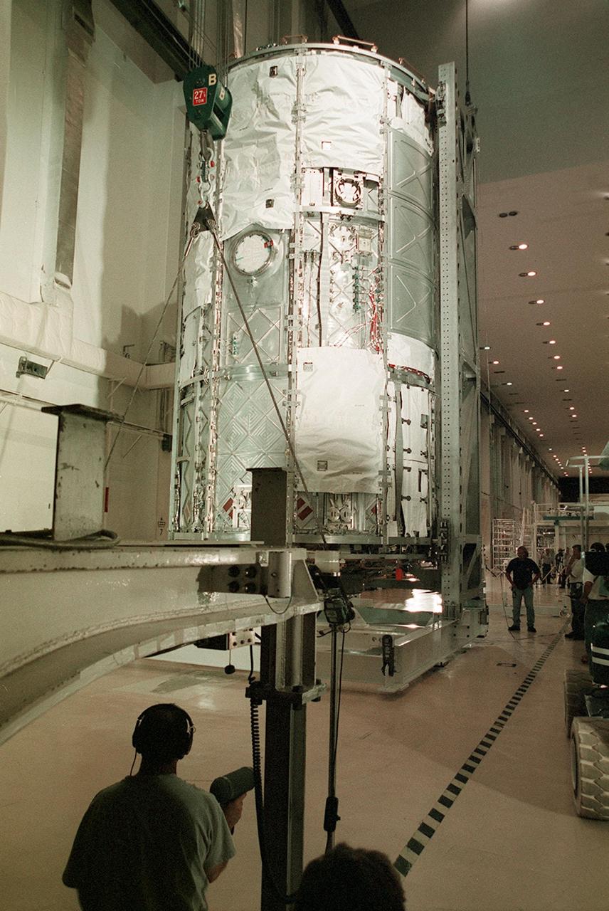 KENNEDY SPACE CENTER, FLA. -- The U.S. Lab, a component of the International Space Station, is moved to the vacuum chamber in the Operations and Checkout Building for testing. The 32,000-pound scientific research lab, named Destiny, is the first Space Station element to spend seven days in the renovated vacuum chamber for a leak test. Destiny is scheduled to be launched on Shuttle mission STS-98, the 5A assembly mission, targeted for Jan. 18, 2001. During the mission, the crew will install the Lab in the Space Station during a series of three space walks. The STS-98 mission will provide the Station with science research facilities and expand its power, life support and control capabilities. The U.S. Lab module continues a long tradition of microgravity materials research, first conducted by Skylab and later Shuttle and Spacelab missions. Destiny is expected to be a major feature in future research, providing facilities for biotechnology, fluid physics, combustion, and life sciences research.