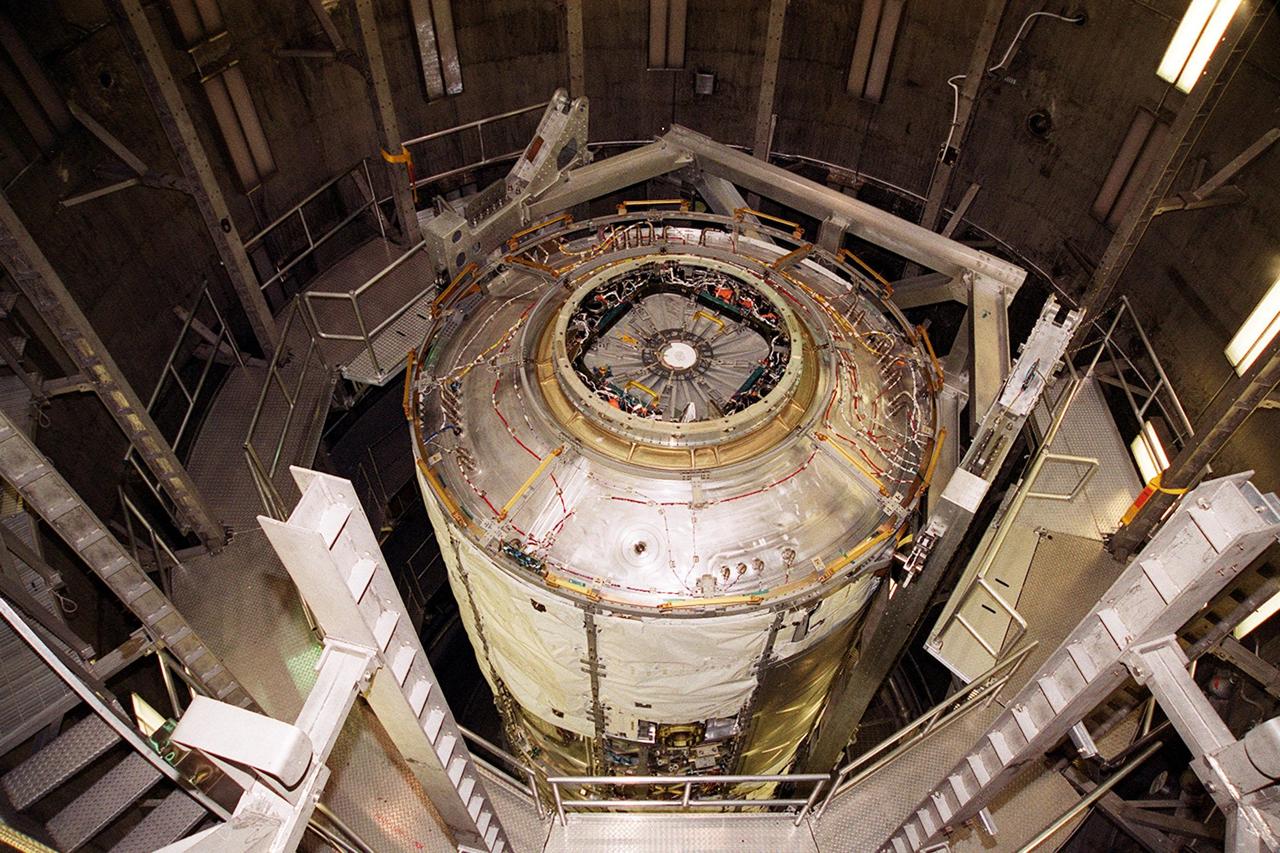 KENNEDY SPACE CENTER, FLA. -- After successfully completing a leak test inside a vacuum chamber in the Operations and Checkout Building, the U.S. Lab, a component of the International Space Station, is ready to be lifted and removed from the chamber. The 32,000-pound scientific research lab, named Destiny, is the first Space Station element to spend seven days in the renovated vacuum chamber. Destiny is scheduled to be launched on Shuttle mission STS-98, the 5A assembly mission, targeted for Jan. 18, 2001. During the mission, the crew will install the Lab in the Space Station during a series of three space walks. The STS-98 mission will provide the Station with science research facilities and expand its power, life support and control capabilities. The U.S. Lab module continues a long tradition of microgravity materials research, first conducted by Skylab and later Shuttle and Spacelab missions. Destiny is expected to be a major feature in future research, providing facilities for biotechnology, fluid physics, combustion, and life sciences research