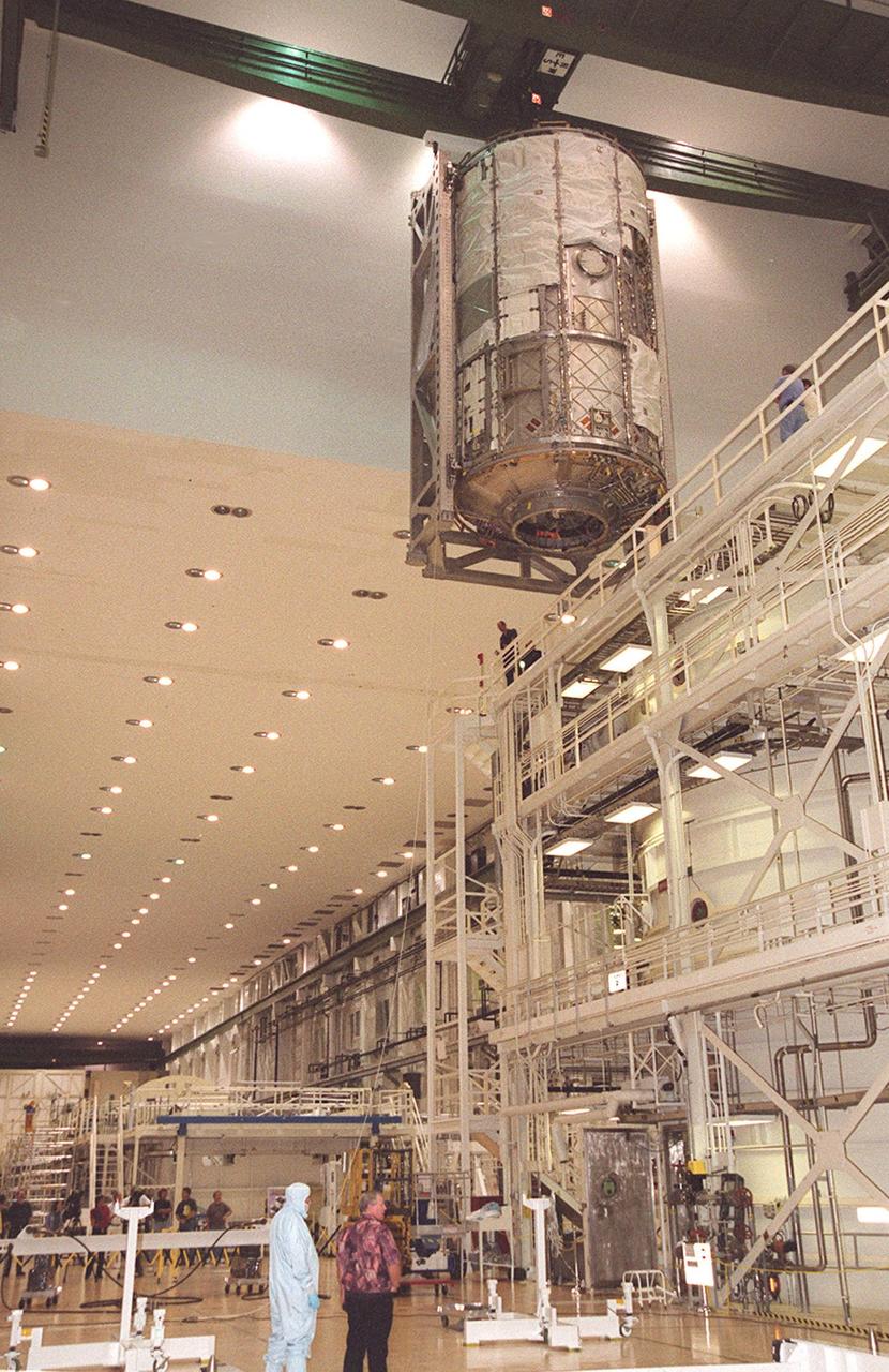KENNEDY SPACE CENTER, FLA. -- In the Operations and Checkout Building, the U.S. Lab moves overhead after being lifted out of the vacuum chamber where it was tested for leaks. The test was very successful. The 32,000-pound scientific research lab, named Destiny, is the first Space Station element to spend seven days in the renovated vacuum chamber. Destiny is scheduled to be launched on Shuttle mission STS-98, the 5A assembly mission, targeted for Jan. 18, 2001. During the mission, the crew will install the Lab in the Space Station during a series of three space walks. The STS-98 mission will provide the Station with science research facilities and expand its power, life support and control capabilities. The U.S. Lab module continues a long tradition of microgravity materials research, first conducted by Skylab and later Shuttle and Spacelab missions. Destiny is expected to be a major feature in future research, providing facilities for biotechnology, fluid physics, combustion, and life sciences research