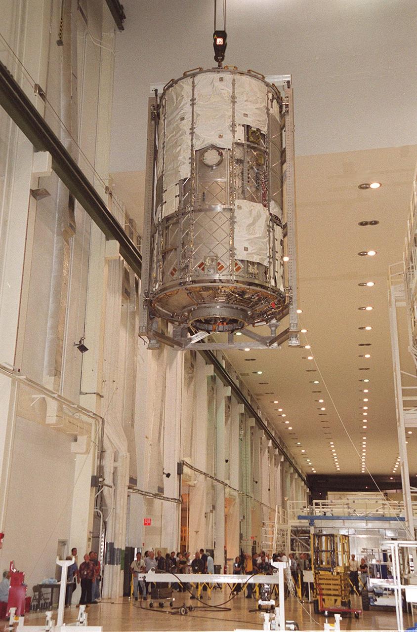 KENNEDY SPACE CENTER, FLA. -- In the Operations and Checkout Building, the U.S. Lab is lowered toward the floor after being lifted out of the vacuum chamber where it was tested for leaks. The test was very successful. The 32,000-pound scientific research lab, named Destiny, is the first Space Station element to spend seven days in the renovated vacuum chamber. Destiny is scheduled to be launched on Shuttle mission STS-98, the 5A assembly mission, targeted for Jan. 18, 2001. During the mission, the crew will install the Lab in the Space Station during a series of three space walks. The STS-98 mission will provide the Station with science research facilities and expand its power, life support and control capabilities. The U.S. Lab module continues a long tradition of microgravity materials research, first conducted by Skylab and later Shuttle and Spacelab missions. Destiny is expected to be a major feature in future research, providing facilities for biotechnology, fluid physics, combustion, and life sciences research