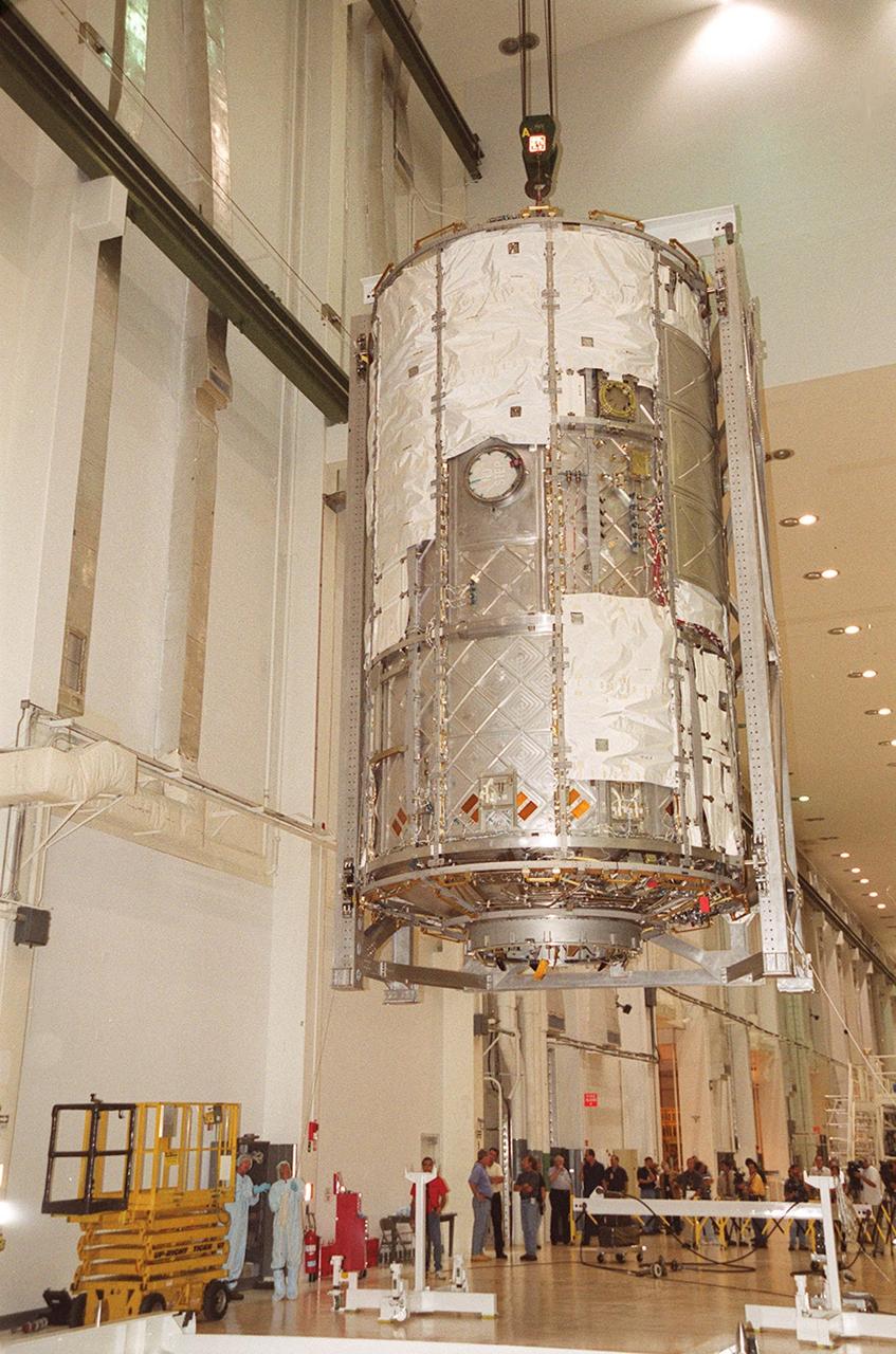 KENNEDY SPACE CENTER, FLA. -- In the Operations and Checkout Building, the U.S. Lab is lowered toward the floor after being lifted out of the vacuum chamber where it was tested for leaks. The test was very successful. The 32,000-pound scientific research lab, named Destiny, is the first Space Station element to spend seven days in the renovated vacuum chamber. Destiny is scheduled to be launched on Shuttle mission STS-98, the 5A assembly mission, targeted for Jan. 18, 2001. During the mission, the crew will install the Lab in the Space Station during a series of three space walks. The STS-98 mission will provide the Station with science research facilities and expand its power, life support and control capabilities. The U.S. Lab module continues a long tradition of microgravity materials research, first conducted by Skylab and later Shuttle and Spacelab missions. Destiny is expected to be a major feature in future research, providing facilities for biotechnology, fluid physics, combustion, and life sciences research