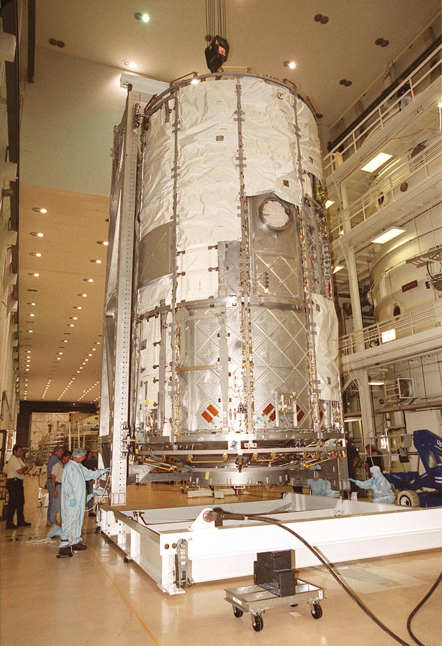 KENNEDY SPACE CENTER, FLA. -- In the Operations and Checkout Building, the U.S. Lab reaches the open floor after being lifted out of the vacuum chamber where it was tested for leaks. The test was very successful. The 32,000-pound scientific research lab, named Destiny, is the first Space Station element to spend seven days in the renovated vacuum chamber. Destiny is scheduled to be launched on Shuttle mission STS-98, the 5A assembly mission, targeted for Jan. 18, 2001. During the mission, the crew will install the Lab in the Space Station during a series of three space walks. The STS-98 mission will provide the Station with science research facilities and expand its power, life support and control capabilities. The U.S. Lab module continues a long tradition of microgravity materials research, first conducted by Skylab and later Shuttle and Spacelab missions. Destiny is expected to be a major feature in future research, providing facilities for biotechnology, fluid physics, combustion, and life sciences research