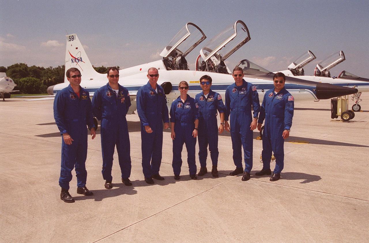 KENNEDY SPACE CENTER, FLA. -- Members of the STS-92 crew line up on the runway at KSC’s Shuttle Landing Facility after arriving to take part in a Crew Equipment Interface Test (CEIT). From left are Mission Specialists Jeff Wisoff and Michael Lopez-Alegria, Commander Brian Duffy, Pilot Pam Melroy, and Mission Specialists Koichi Wakata, Bill McArthur and Leroy Chiao. Wakata is with the Japanese space agency. During the CEIT, the crew will spend time at SPACEHAB becoming familiar with the payload and equipment they will use on their mission to the International Space Station. The mission payload includes the Integrated Truss Structure Z1, an early exterior framework to allow the first U.S. solar arrays on a future flight to be temporarily installed on Unity for early power; Ku-band communication to support early science capability and U.S. television; and PMA-3 to provide a Shuttle docking port for solar array installation on the sixth ISS flight and Lab installation on the seventh ISS flight. STS-92 is scheduled to launch Oct. 5 from launch Pad 39A