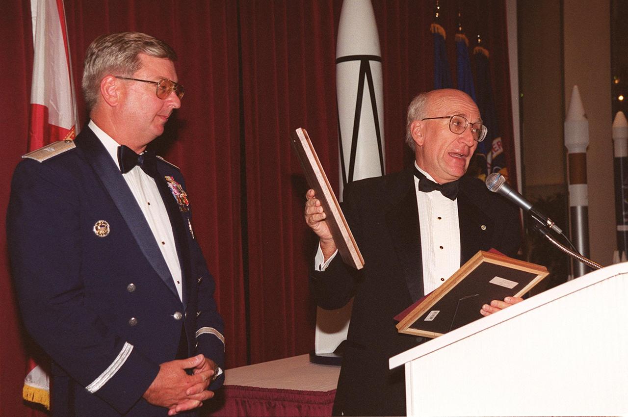 At a 50th anniversary gala capping a year-long celebration of 50 years of launches from Cape Canaveral Air Force Station, Brig. Gen. Donald Pettit (left) receives a plaque from committee chairman Ed Gormel. The first launch took place at 9:28 a.m. on July 24, 1950, with the liftoff of Bumper 8 from Launch Complex 3. The gala, hosted by the Cape Canaveral Chapter Air Force Association, featured such speakers as Center Director Roy Bridges; Vice Commander, Air Force Space Command, Lt. Gen. Roger DeKok; and the Honorable David Weldon, U.S. representative of Florida’s 15th Congressional District