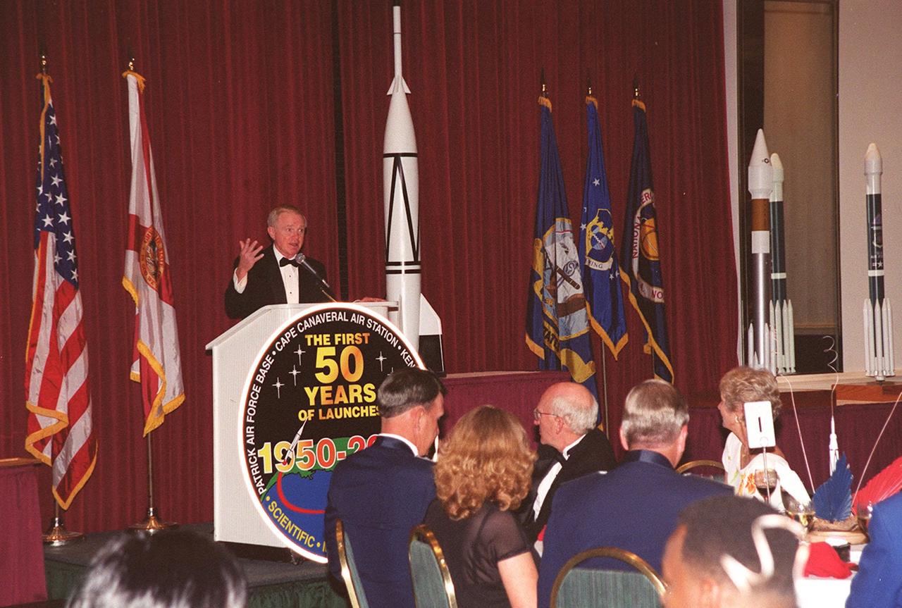 Center Director Roy Bridges addresses attendees at a 50<sup>th</sup> anniversary gala capping a year-long celebration of 50 years of launches from Cape Canaveral Air Force Station. Among those at the head table directly in front of the podium are Commander of the 45<sup>th</sup> Space Wing Brig. Gen. Donald Pettit and Gala Committee Chairman Ed Gormel. The first launch at CCAFS took place at 9:28 a.m. on July 24, 1950, with the liftoff of Bumper 8 from Launch Complex 3