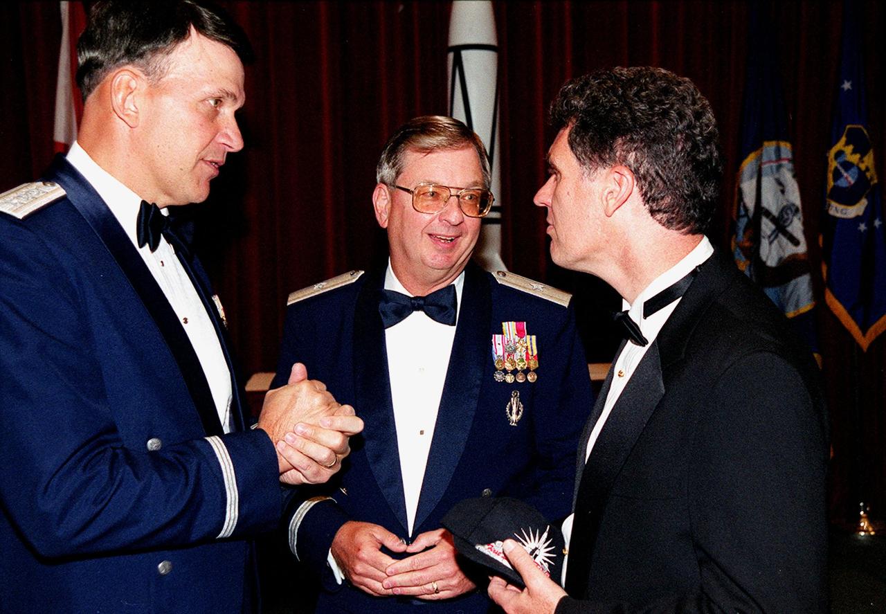 At a 50th anniversary gala capping a year-long celebration of 50 years of rocket launches from Cape Canaveral Air Force Station, Vice Commander, Air Force Space Command, Lt. Gen. Roger DeKok; Commander, 45th Space Wing, Brig. Gen. Donald Pettit; and U.S. representative of Florida’s 15th Congressional District, David Weldon gather for a discussion. They were speakers at the gala. The first launch at CCAFS took place at 9:28 a.m. on July 24, 1950, with the liftoff of Bumper 8 from Launch Complex 3. The gala was hosted by the Cape Canaveral Chapter Air Force Association