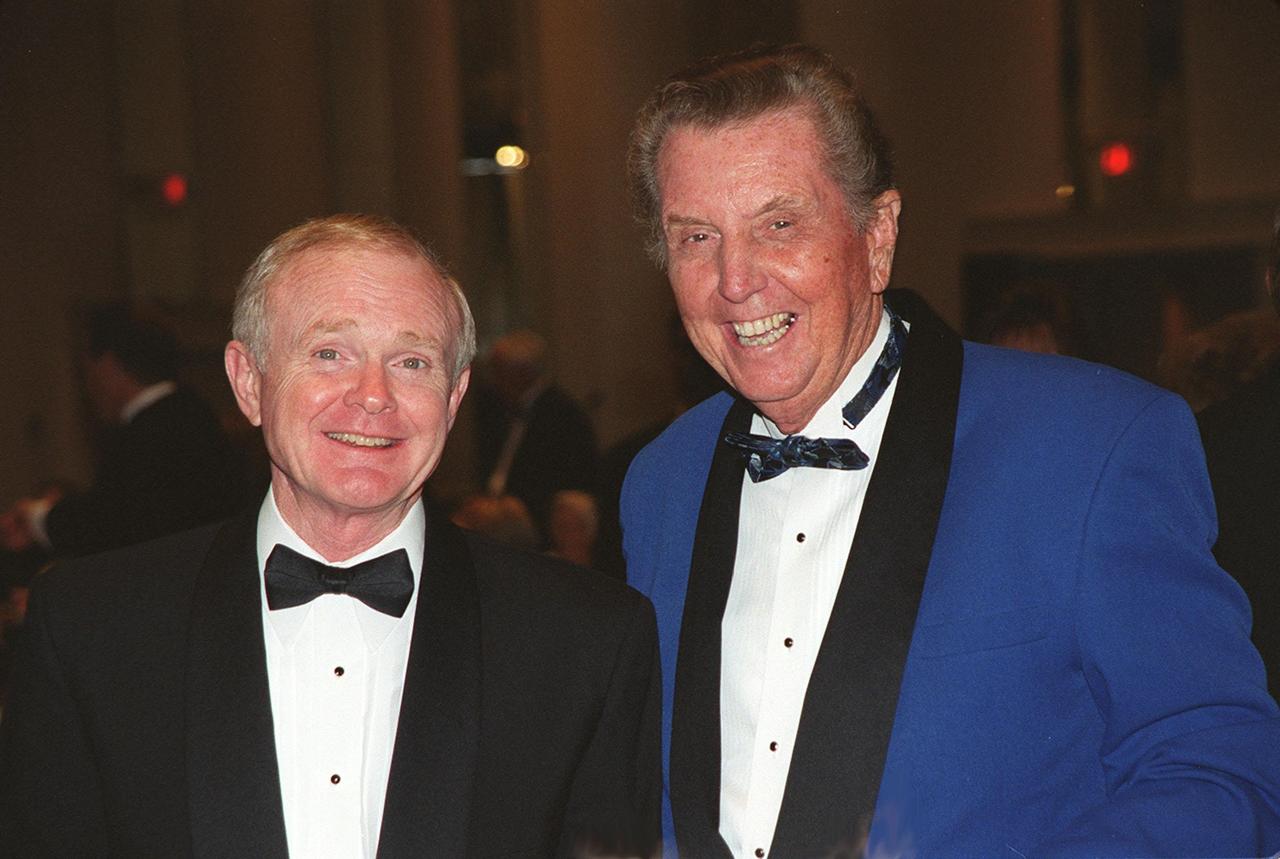 Posing for a photograph during the 50th anniversary gala capping a year-long celebration of 50 years of rocket launches from Cape Canaveral Air Force Station are Center Director Roy Bridges (left) and renowned NBC broadcaster, author and emcee Jay Barbree. The first launch at CCAFS took place at 9:28 a.m. on July 24, 1950, with the liftoff of Bumper 8 from Launch Complex 3. The gala was hosted by the Cape Canaveral Chapter Air Force Association