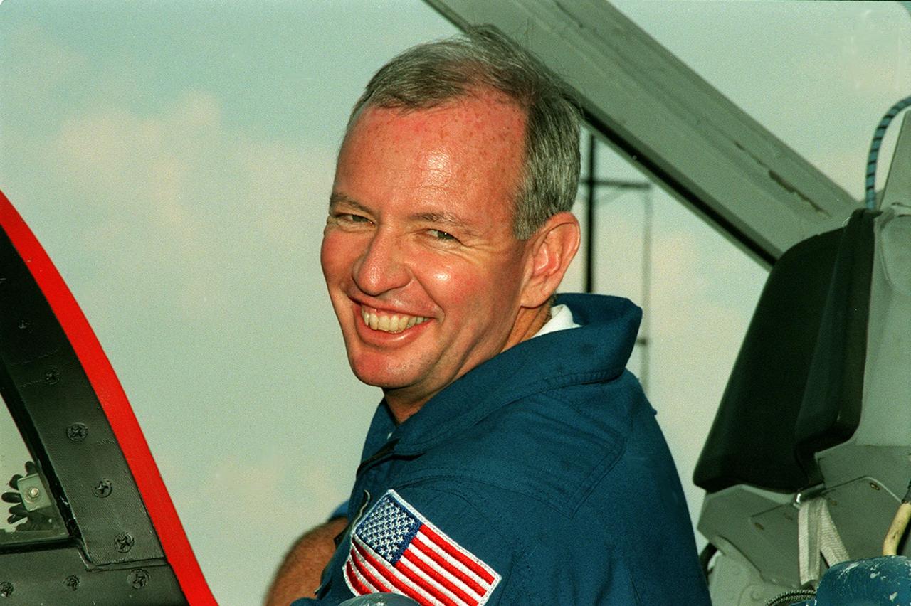 STS-92 Commander Brian Duffy climbs into a T-38 jet aircraft at KSC’s Shuttle Landing Facility for a flight back to Houston. He and other crew members were at KSC for Crew Equipment Interface Test (CEIT) activities, looking over their mission payload and related equipment. STS-92 is scheduled to launch Oct. 5 on Shuttle Discovery from Launch Pad 39A on the fifth flight to the International Space Station. Discovery will carry the Integrated Truss Structure (ITS) Z1, the PMA-3, Ku-band Communications System, and Control Moment Gyros (CMGs)