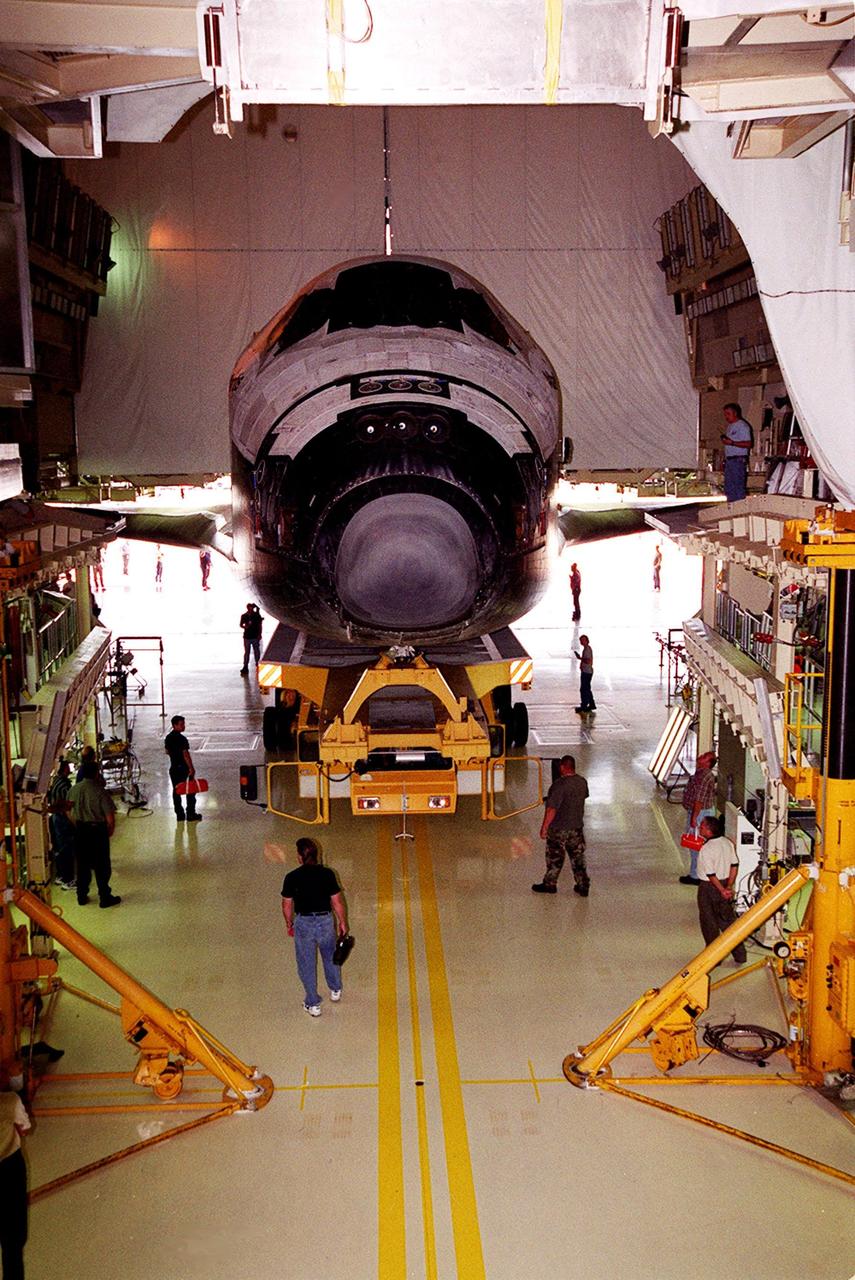 KENNEDY SPACE CENTER, Fla. -- The orbiter Atlantis begins its move out of the Orbiter Processing Facility bay 3 over to the Vehicle Assembly Building (VAB). In the VAB it will be lifted to vertical and placed aboard the mobile launcher platform (MLP) for stacking with the solid rocket boosters and external tank. Atlantis is scheduled to launch Sept. 8 on mission STS-106, the fourth construction flight to the International Space Station, with a crew of seven
