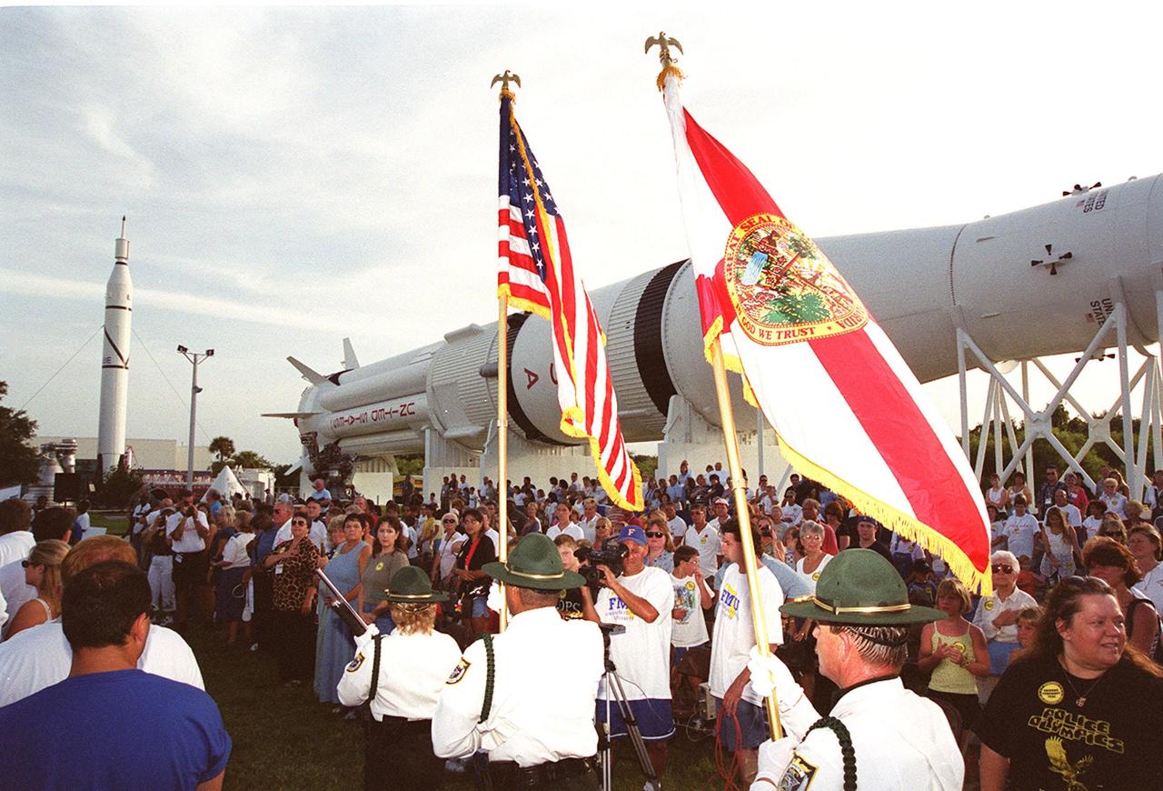 An international gathering of police officers march in a parade at the KSC Visitor Complex during opening ceremonies of the 2000 International Law Enforcement Games. More than 1,850 participants and their families took part in the opening, held in the Rocket Garden. The ceremony includes parades, torch lighting and a tug of war. The games feature officers from 15 countries and 37 United States in competitions around Brevard County, Fla