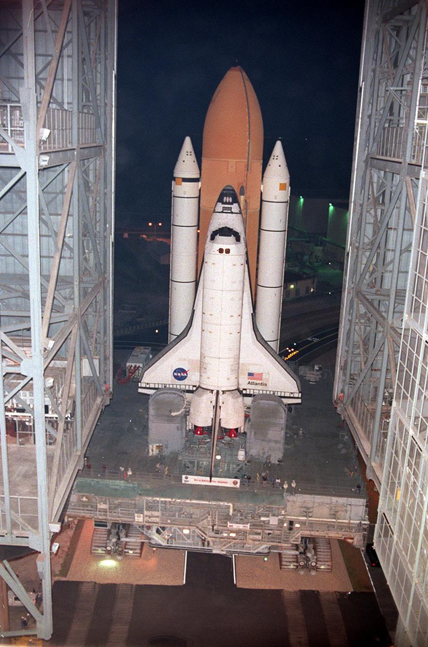 KENNEDY SPACE CENTER, FLA. -- For the first time in Space Shuttle history, a fully stacked Shuttle -  Atlantis -  moves into high bay 2, on the west side of the Vehicle Assembly Building (VAB).   The VAB and nearby rock-paved crawlerway have recently undergone major modifications to provide Shuttle fliglht hardware more storage space and protection - "Safe Haven" - from hurricanes or tropical storms.  Atlantis begain moving out of VAB high bay 1 on the east side at 2:59 a.m. EDT.  After the successful "Safe Haven" fit check, Shuttle Atlantis is scheduled to roll out to Launch Pad 39B in preparation for the STS-106 launch on Sept. 8.