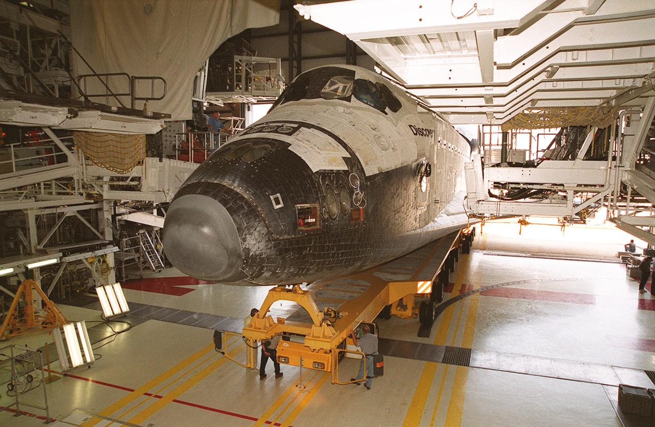 KENNEDY SPACE CENTER, FLA. -- The orbiter Discovery is being prepped inside the Orbiter Processing Facility (OPF) bay 1 for a "roll around" to OPF bay 3 where ongoing payload and ground processing assessments will be completed.  Managers will then determine when to roll the orbiter to the Vehicle Assembly Building for stacking with the external tank and soid rocket boosters, and when to roll out to Launch Pad 39A.  Discovery is scheduled to launch Oct. 5 at 9:30 p.m. EDT on mission STS-92, which will be the 100th flight in the Shuttle program.