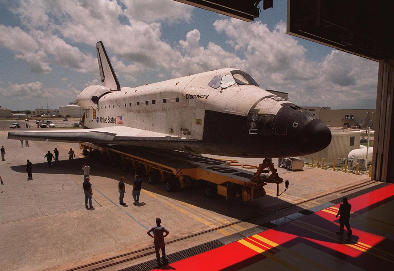 KENNEDY SPACE CENTER, FLA. -- The orbiter Discovery is rolled out of the Orbiter Processing Facility bay 3 for transfer to the Vehicle Assembly Building, where it will be mated with its external tank and solid rocket boosters. Discovery is scheduled to launch Oct. 5 at 9:30 p.m. EDT on mission STS-92, delivering two elements of the International Space Station: the Z-1 truss and PMA-3. The launch will be the 100th flight in the Shuttle program.