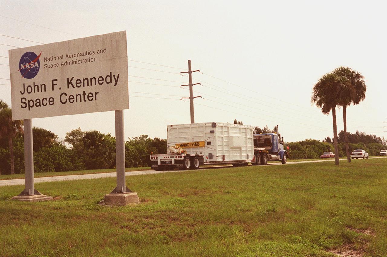 KENNEDY SPACE CENTER, FLA. -- The Mobile Remote Servicer Base System (MBS), part of the Canadian Space Agency's (CSA) Space Station Remote Manipulator System (SSRMS), arrives by truck at Kennedy Space Center. It is being taken to the Space Station Processing Facility. The SSRMS is part of the payload on mission STS-100, the ninth flight to the International Space Station