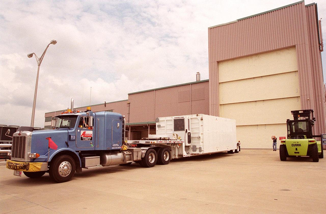 KENNEDY SPACE CENTER, FLA. -- The Mobile Remote Servicer Base System (MBS), part of the Canadian Space Agency's (CSA) Space Station Remote Manipulator System (SSRMS), arrives at the Space Station Processing Facility. The SSRMS is part of the payload on mission STS-100, the ninth flight to the International Space Station