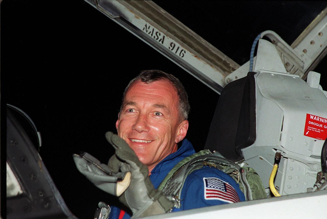 STS-106 Commander Terrence W. Wilcutt waves to onlookers as he arrives at the KSC Shuttle Landing Facility. He and the rest of the crew will be making pre-launch preparations for the fourth flight to the International Space Station. STS-106 is scheduled to launch Sept. 8, 2000, at 8:45 a.m. EDT from Launch Pad 39B. On the 11-day mission, the seven-member crew will perform support tasks on orbit, transfer supplies and prepare the living quarters in the newly arrived Zvezda Service Module. The first long-duration crew, dubbed “Expedition One,” is due to arrive at the Station in late fall