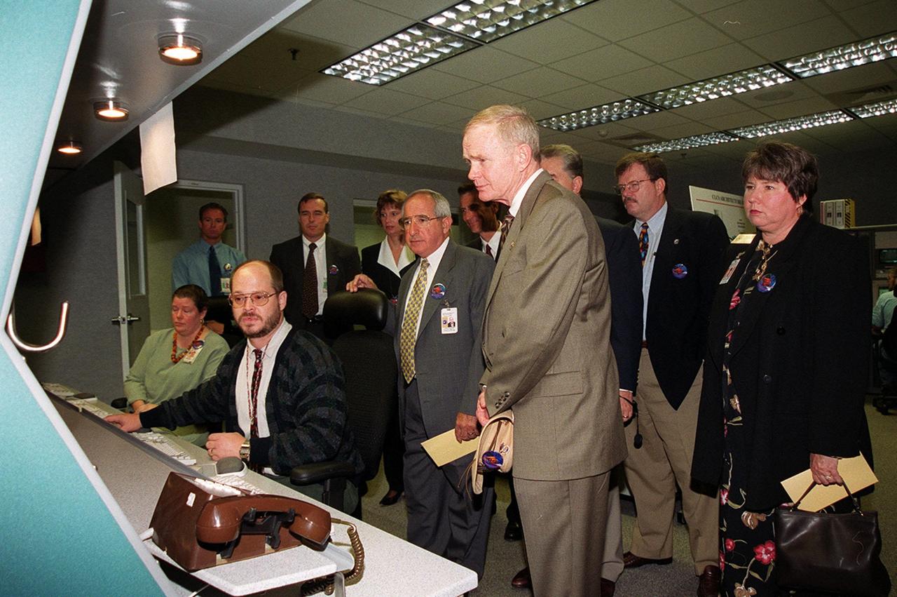 KSC Director Roy Bridges (center) and guests view the new Checkout and Launch Control System (CLCS) at the Hypergolic Maintenance Facility (HMF). Looking on next to him (left) is NASA Associate Administrator for Space Flight Joseph Rothenberg and Pam Gillespie (far right), from Rep. Dave Weldon’s office. The CLCS was declared operational in a ribbon cutting ceremony earlier. The new control room will be used to process the Orbital Maneuvering System pods and Forward Reaction Control System modules at the HMF. This hardware is removed from Space Shuttle orbiters and routinely taken to the HMF for checkout and servicing