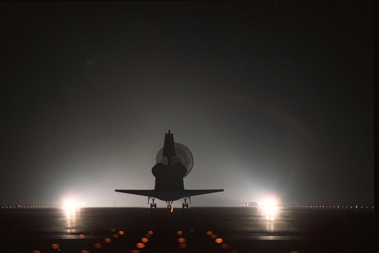 KENNEDY SPACE CENTER, FLA. -- Atlantis is silhouetted by the brilliant runway lights as it lands on Runway 15 of the KSC Shuttle Landing Facility. Main gear touchdown was at 3:56:48 a.m. EDT, landing on orbit 185 of the mission. Nose gear touchdown was at 3:56:57 a.m. EDT and wheel stop at 3:58:01 a.m. EDT.; Atlantis and crew traveled 4.9 million miles on the 11-day, 19-hour, 11-minute mission STS-106. During the mission to the International Space Station, the crew transferred nearly 5,000 pounds of equipment and supplies for use by the first resident crew expected to arrive in November. STS-106 was the 99th flight in the Shuttle program and the 22nd for Atlantis. STS-106 also marked the 15th nighttime landing in Shuttle history and the 23rd consecutive landing at KSC