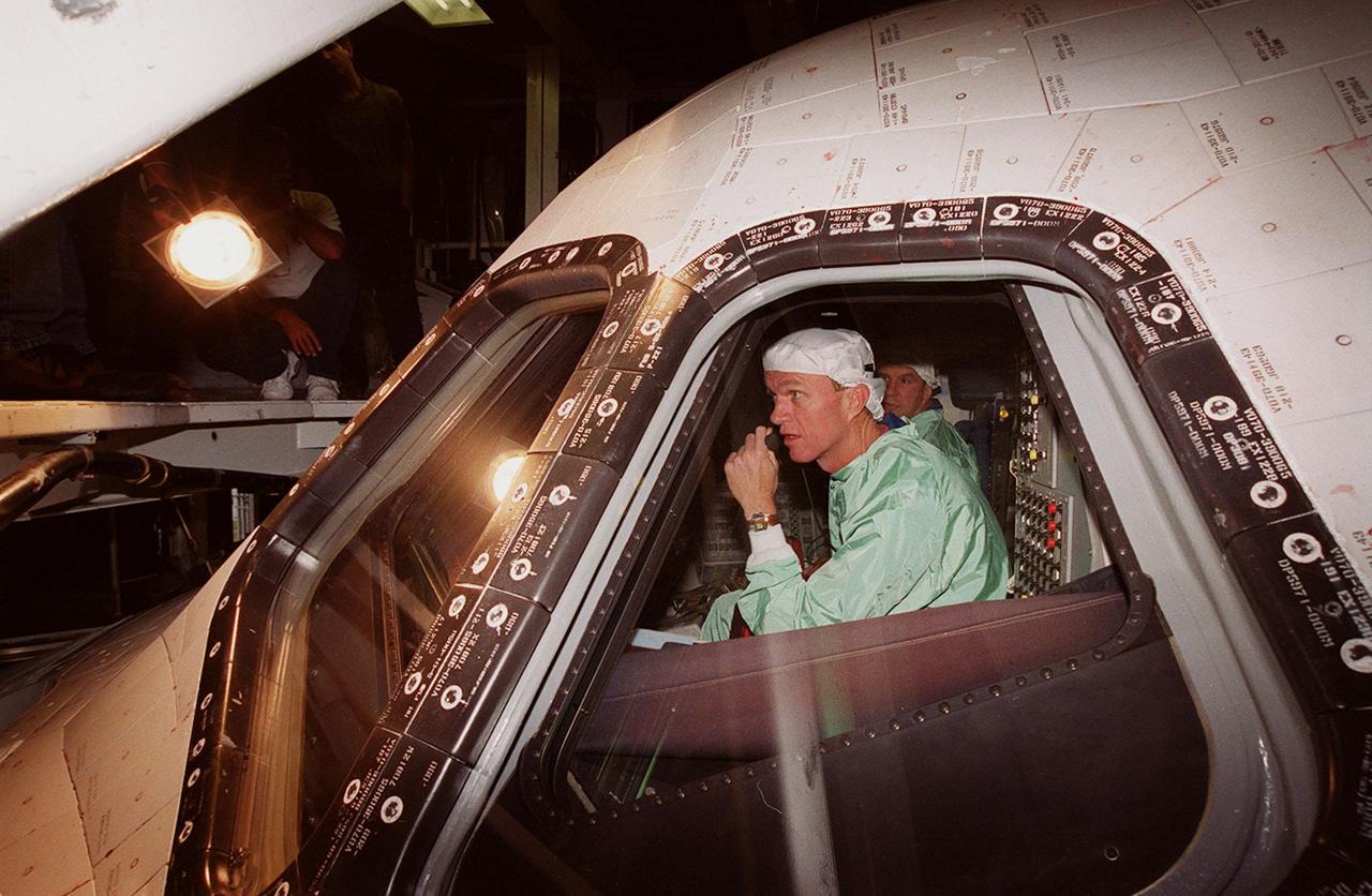 In Orbiter Processing Facility bay 2 during a Crew Equipment Interface Test (CEIT), STS-97 Commander Brent Jett (left) and Pilot Michael Bloomfied (right) check out the cockpit of orbiter Endeavour as part of preflight preparations. The CEIT provides an opportunity for crew members to check equipment and facilities that will be on board the orbiter during their mission. The STS-97 mission will be the sixth construction flight to the International Space Station. The payload includes a photovoltaic (PV) module, providing solar power to the Station. STS-97 is scheduled to launch Nov. 30 from KSC for the 10-day mission