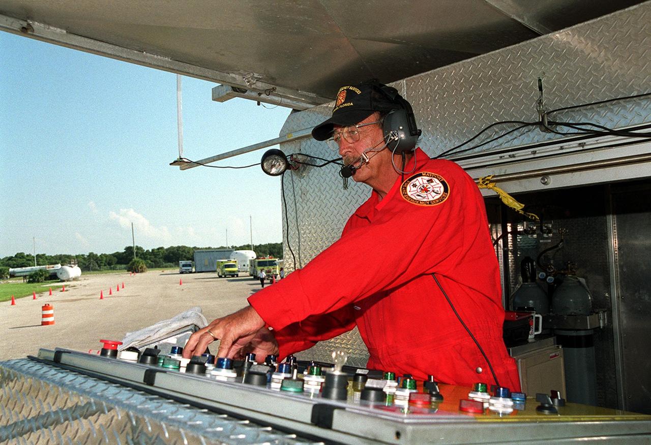 KENNEDY SPACE CENTER, FLA. -- A training officer controls elements of a fire training exercise at Cape Canaveral Air Force Station Pad 30 for firefighters with Fire and Emergency Services at the Naval Station Mayport, Fla. The firefighters tackled flames from a burning simulated aircraft.