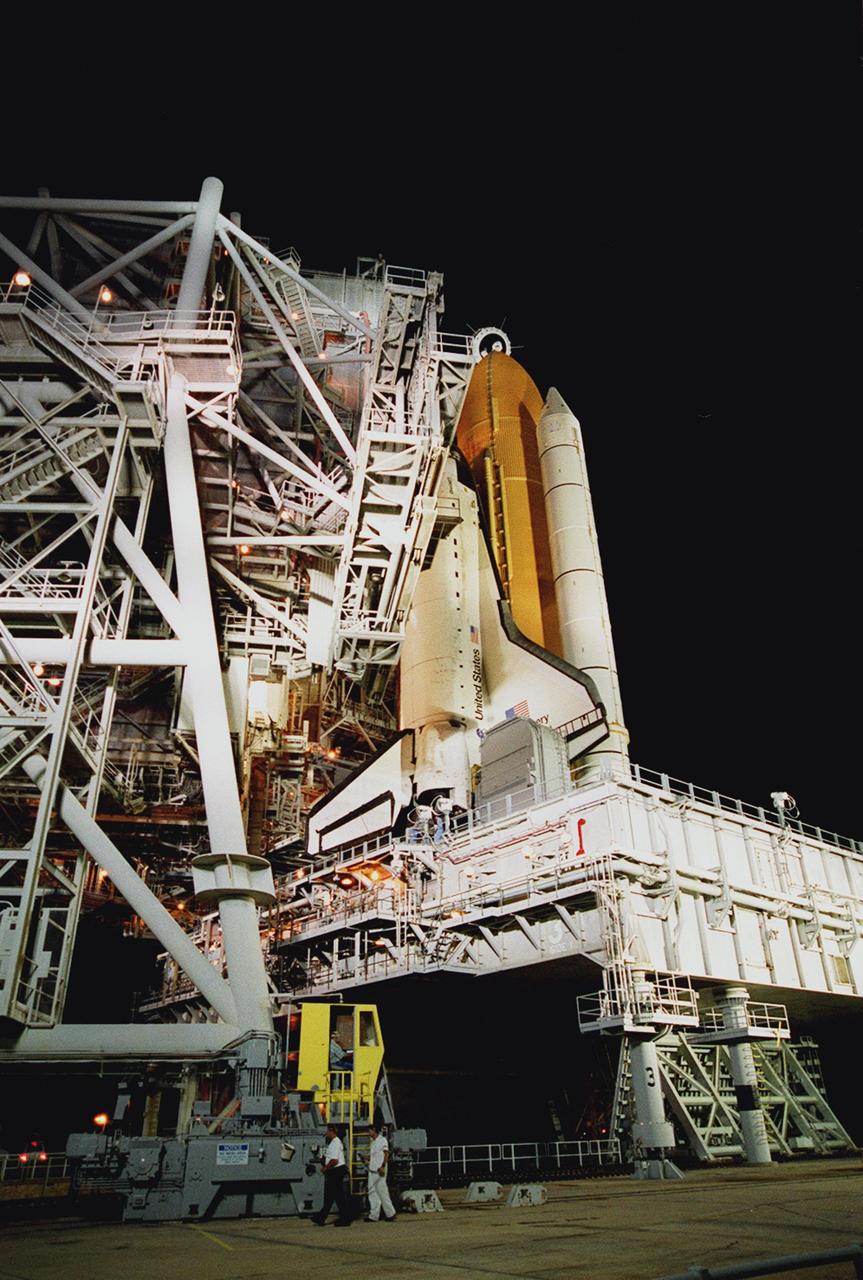KENNEDY SPACE CENTER, Fla. --  The Rotating Service Structure at Launch Pad 39A rolls back, revealing the Space Shuttle Discovery on the Mobile Launcher Platform. Discovery is being readied for the STS-92 mission launch to the International Space Station (ISS). The mission payload includes Integrated Truss Structure Z-1, an early exterior framework to allow the first U.S. solar arrays on a future flight to be temporarily installed on Unity for early power; Ku-band communication to support early science capability and U.S. television; and the third Pressurized Mating Adapter to provide a Shuttle docking port for solar array installation on the sixth ISS flight and Lab installation on the seventh ISS flight. The 11-day mission will include four spacewalks. Liftoff is scheduled for Oct. 6 at 9:16 p.m. EDT