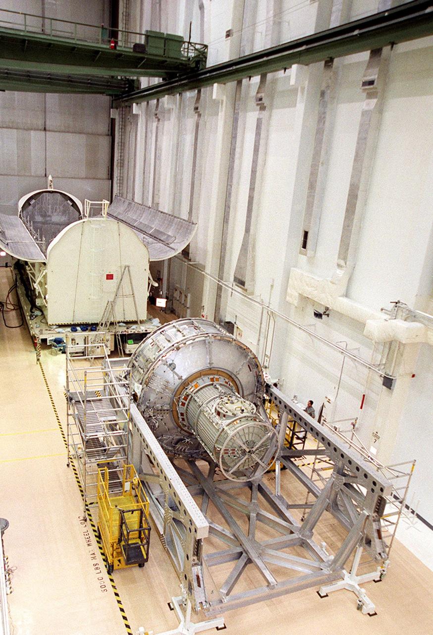 KENNEDY SPACE CENTER, FLA. -- In the Operations and Checkout Building, the Joint Airlock Module waits for transfer to the payload canister behind it after which it will be moved to the Space Station Processing Facility. There it will continue to undergo preflight processing for the STS-104 mission scheduled for launch aboard Space Shuttle Atlantis May 17, 2001. The Joint Airlock Module is the gateway from which crew members aboard the International Space Station will enter and exit the 470-ton orbiting research facility