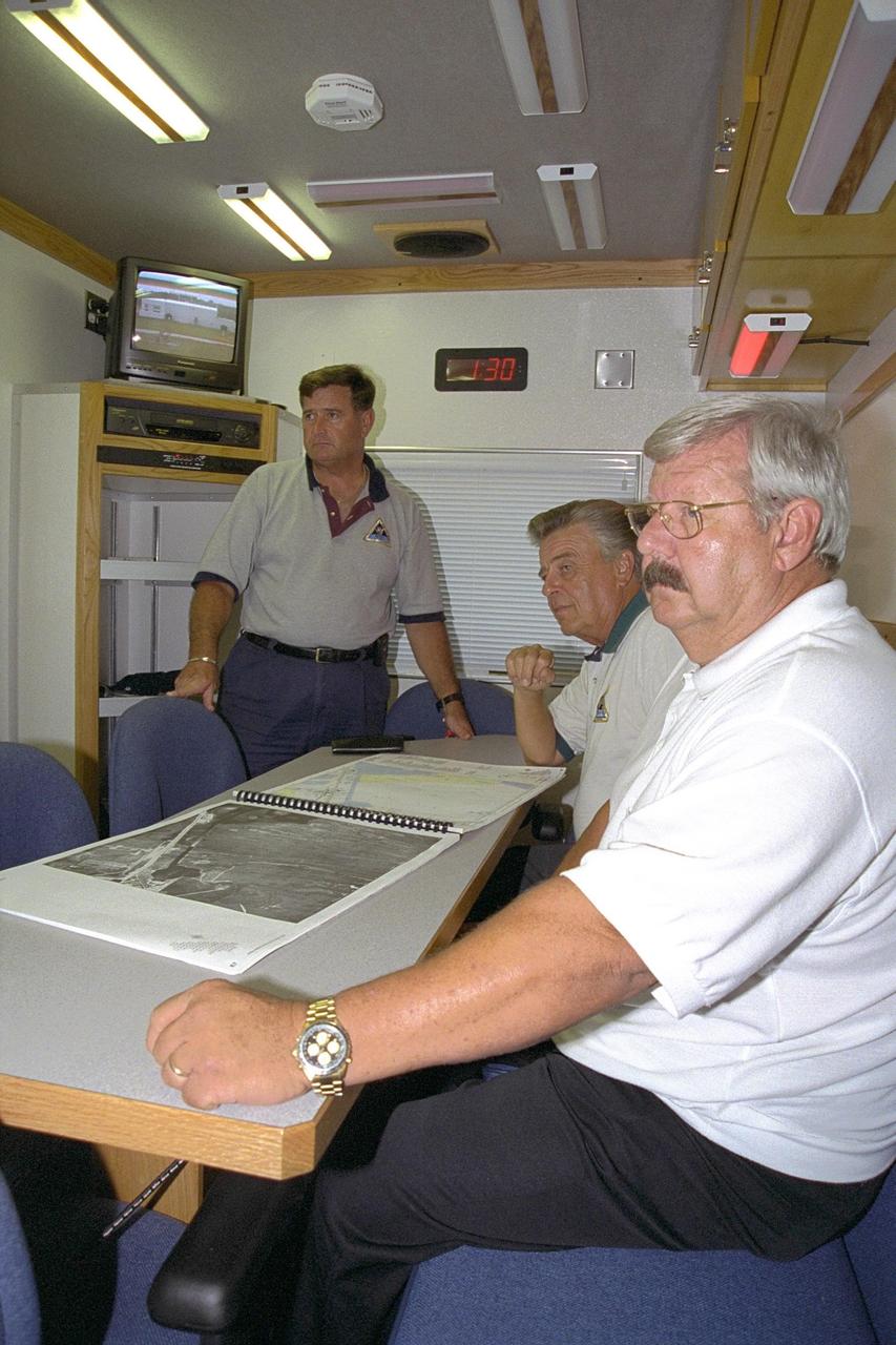Charles Street, Roger Scheidt and Robert ZiBerna, the Emergency Preparedness team at KSC, sit in the conference room inside the Mobile Command Center, a specially equipped vehicle. Nicknamed “The Brute,” it also features computer work stations, mobile telephones and a fax machine. It also can generate power with its onboard generator. Besides being ready to respond in case of emergencies during launches, the vehicle must be ready to help address fires, security threats, chemical spills, terrorist attaches, weather damage or other critical situations that might face KSC or Cape Canaveral Air Force Station