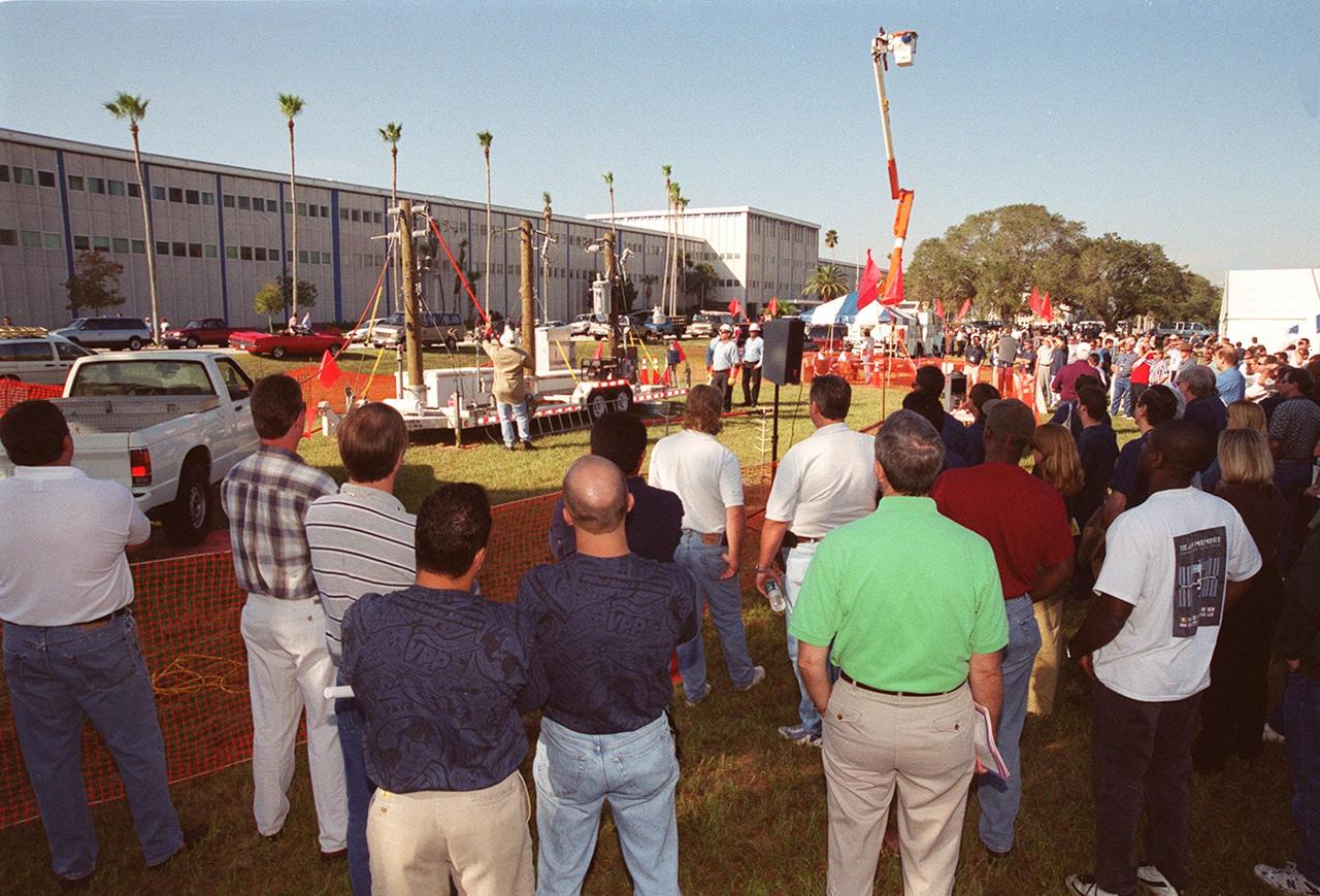 Employees gather around a demonstration by Florida Power and Light during Super Safety and Health Day at KSC. Safety Day is a full day of NASA-sponsored, KSC and 45th Space Wing events involving a number of healthand safety-related activities: Displays, vendors, technical paper sessions, panel discussions, a keynote speaker, etc. The entire Center and Wing stand down to participate in the planned events. Safety Day is held annually to proactively increase awareness in safety and health among the government and contractor workforce population. The first guiding principle at KSC is “Safety and Health First.” KSC’s number one goal is to “Assure sound, safe and efficient practices and processes are in place for privatized/commercialized launch site processing.