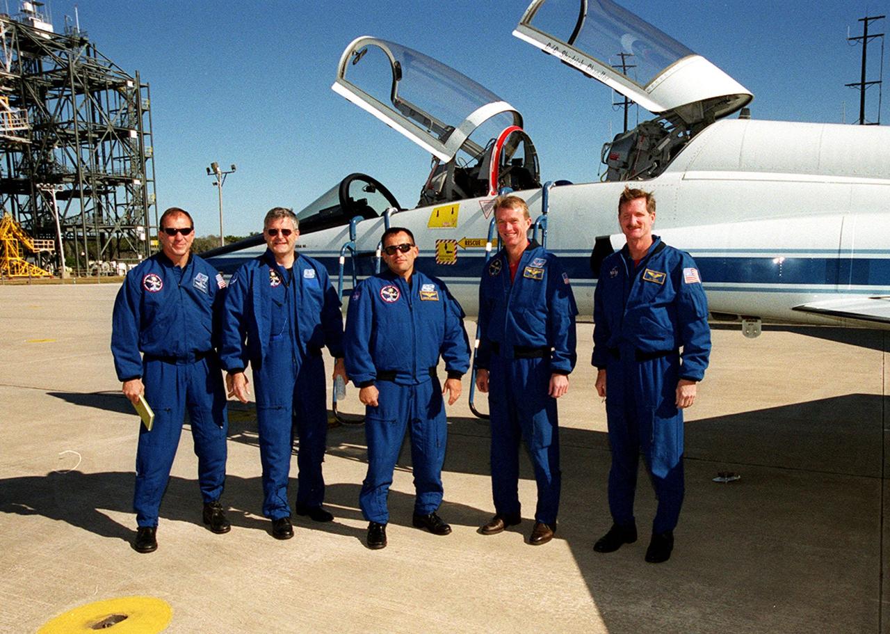 The STS-97 crew poses for a photo at the Shuttle Landing Facility after their arrival. Standing left to right are Pilot Michael Bloomfield, Mission Specialists Marc Garneau and Carlos Noriega, Commander Brent Jett and Mission Specialist Joseph Tanner. They are at KSC for a final payload walkdown before launch, scheduled for Nov. 30 at 10:06 p.m. EST from Launch Pad 39B. The sixth flight to the International Space Station, the mission is expected to last 11 days, with a planned KSC landing at about 5:58 p.m. Dec. 11