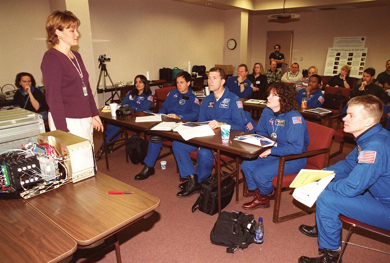 KENNEDY SPACE CENTER, FLA. -- The STS-107 crew takes part in In-Flight Maintenance training, learning more about experiments that will be part of the mission. Seated in front (left to right) are Mission Specialist Kalpana Chawla, Payload Specialist Ilan Ramon of Israel; Commander Rick D. Husband; Mission Specialist Laurel Clark; and Pilot William C. “Willie” McCool; in back are Mission Specialists David M. Brown and Michael Anderson. As a research mission, STS-107 will carry the SPACEHAB Double Module in its first research flight into space and a broad collection of experiments ranging from material science to life science. It is scheduled to launch July 19, 2001
