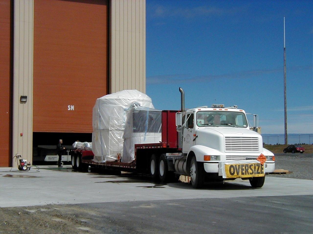 KODIAK ISLAND, Alaska -- Trucks transporting Orbis 21D Equipment Section Boost Motor, the second stage of the Athena 1 launch vehicle, arrive at Kodiak Island, Alaska, as preparations to launch Kodiak Star proceed.  The first orbital launch to take place from Alaska's Kodiak Launch Complex, Kodiak Star is scheduled to lift off on a Lockheed Martin Athena I launch vehicle on Sept. 17 during a two-hour window that extends from 5:00 to 7:00 p.m. ADT.  The payloads aboard include the Starshine 3, sponsored by NASA, and the PICOSat, PCSat and Sapphire, sponsored by the Department of Defense (DoD) Space Test Program.  