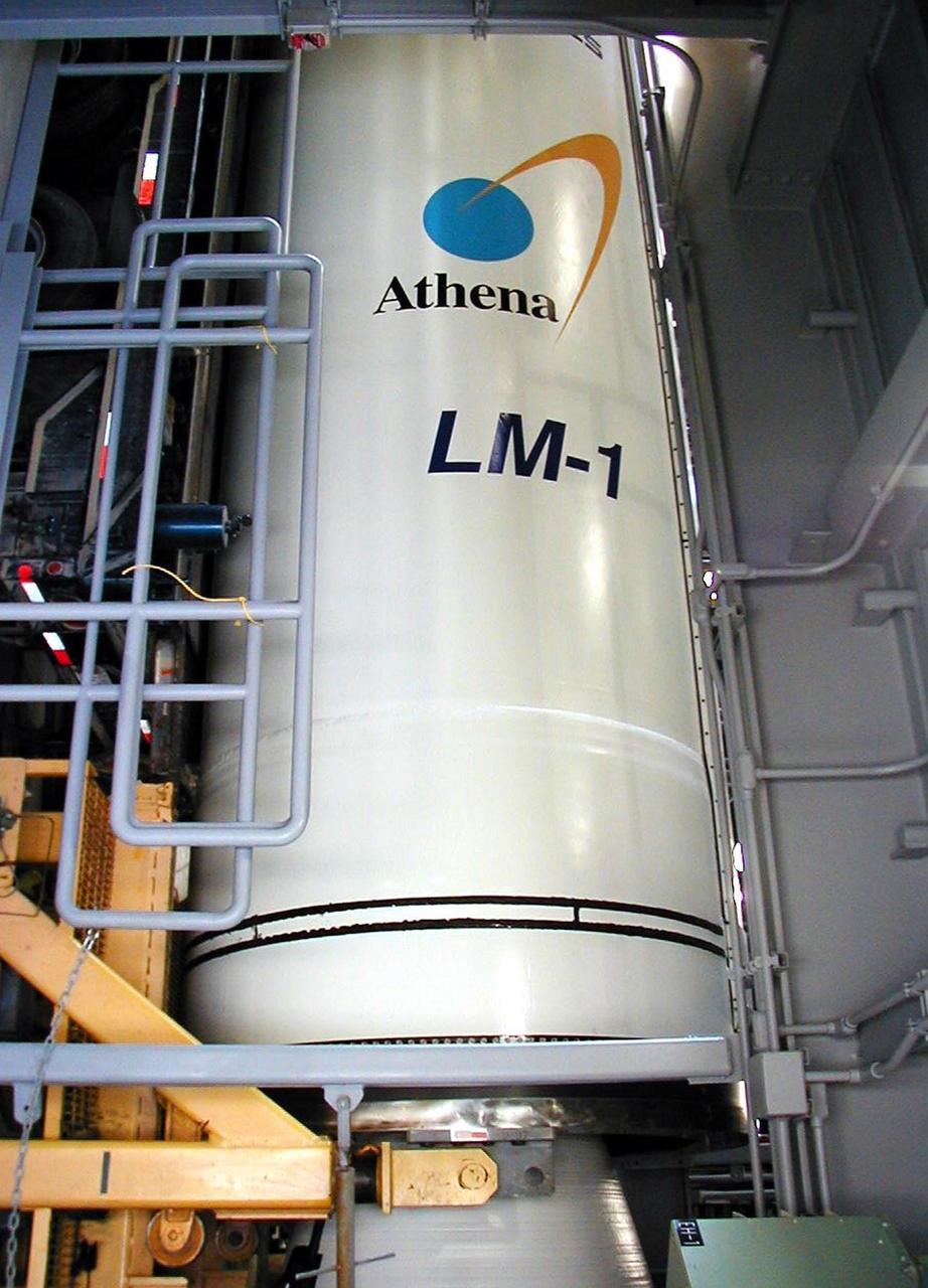 KODIAK ISLAND, Alaska -- Castor 120, the first stage of the Athena 1 launch vehicle, is raised off a truck at the launch pad at Kodiak Island, Alaska, as preparations to launch Kodiak Star proceed.  The first orbital launch to take place from Alaska's Kodiak Launch Complex, Kodiak Star is scheduled to lift off on a Lockheed Martin Athena I launch vehicle on Sept. 17 during a two-hour window that extends from 5:00 to 7:00 p.m. ADT.  The payloads aboard include the Starshine 3, sponsored by NASA, and the PICOSat, PCSat and Sapphire, sponsored by the Department of Defense (DoD) Space Test Program.  