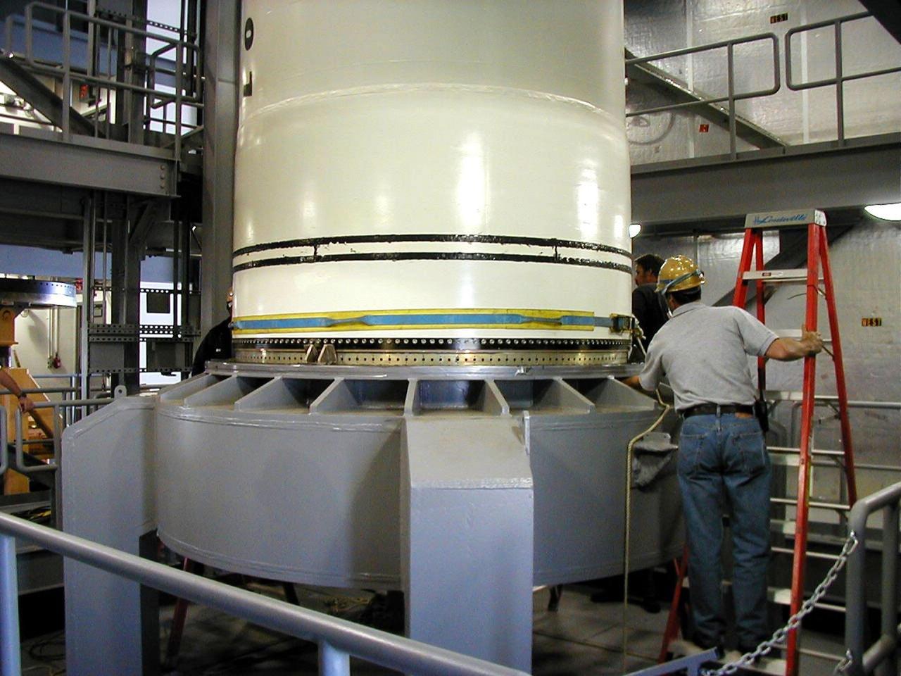 KODIAK ISLAND, Alaska -- Technicians inspect and secure Castor 120, the first stage of the Athena 1 launch vehicle, on the launch mount at Kodiak Island, Alaska, as processing for the launch of Kodiak Star proceeds.  The first orbital launch to take place from Alaska's Kodiak Launch Complex, Kodiak Star is scheduled to lift off on a Lockheed Martin Athena I launch vehicle on Sept. 17 during a two-hour window that extends from 5:00 to 7:00 p.m. ADT.  The payloads aboard include the Starshine 3, sponsored by NASA, and the PICOSat, PCSat and Sapphire, sponsored by the Department of Defense (DoD) Space Test Program.           