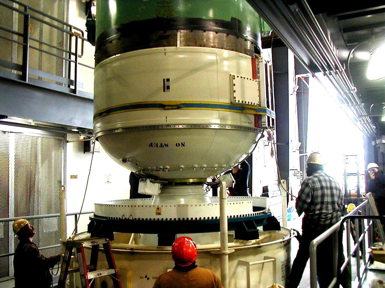 KODIAK ISLAND, Alaska -- Technicians install Orbis 21D Equipment Section Boost Motor, the second stage of the Athena 1 launch vehicle, at Kodiak Island, Alaska, as processing for the launch of Kodiak Star proceeds. The first orbital launch to take place from Alaska's Kodiak Launch Complex, Kodiak Star is scheduled to lift off on a Lockheed Martin Athena I launch vehicle on Sept. 17 during a two-hour window that extends from 5:00 to 7:00 p.m. ADT. The payloads aboard include the Starshine 3, sponsored by NASA, and the PICOSat, PCSat and Sapphire, sponsored by the Department of Defense (DoD) Space Test Program.
