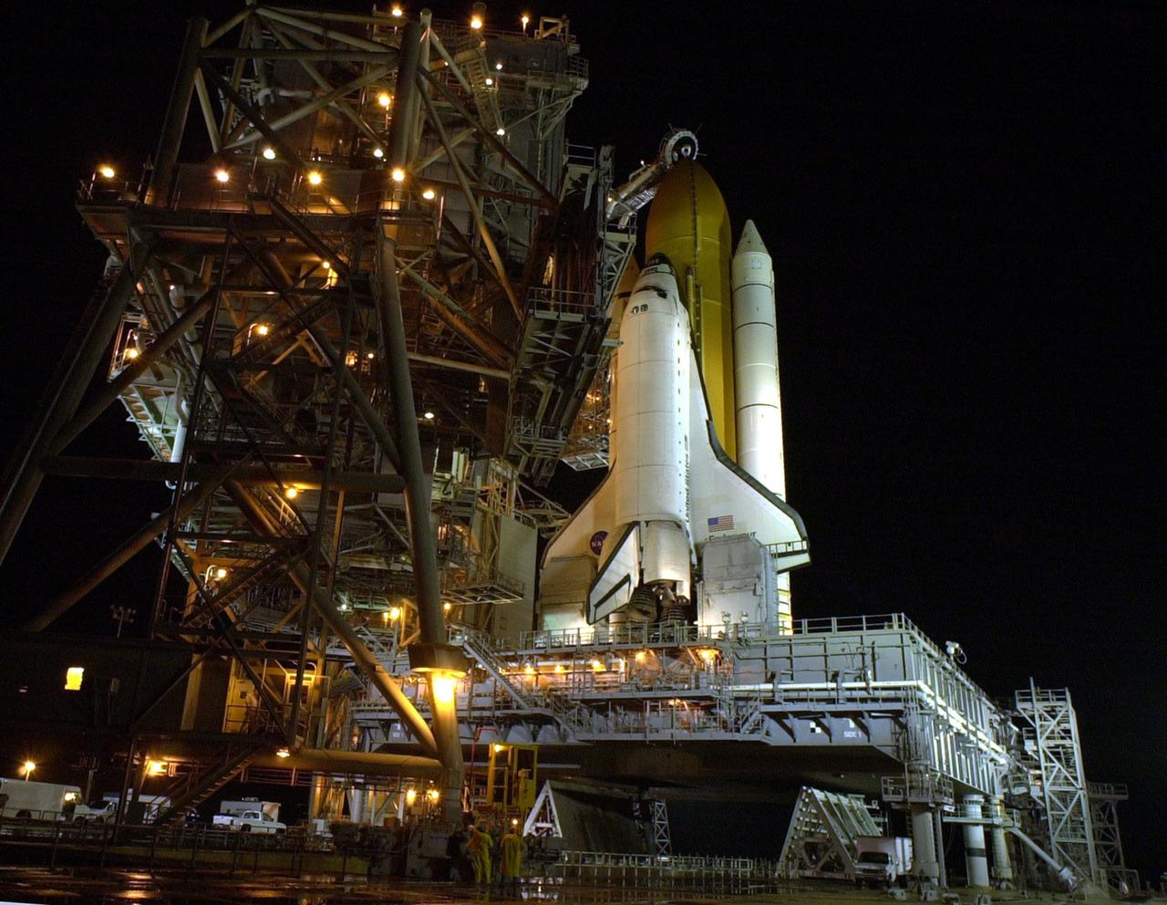 KENNEDY SPACE CENTER, Fla. --  The Rotating Service Structure on Launch Pad 39B rolls away from Space Shuttle Endeavour atop the Mobile Launcher Platform.   The Space Shuttle comprises the orbiter and an external tank flanked by twin solid rocket boosters. Above the external tank is the Gaseous Oxygen Vent Arm that vents gaseous oxygen vapors away from the Shuttle.  The vent hood assembly at the end is often referred to as the "beanie cap."   On either side of the orbiter's tail and main engines are two tail masts that support the fluid, gas and electrical requirements of the orbiter's liquid oxygen and liquid hydrogen aft T-0 umbilicals. .  Each tail mast is 31 feet (9.4 meters) high, 15 feet (4.6 meters) long and 9 feet (3.1 meters) wide.   Endeavour is scheduled to launch on mission STS-108 Dec. 4 at 5:45  p.m. EST.  On this 12th flight to the International Space Station, known as a Utilization Flight, Endeavour will carry a crew of four plus the Expedition 4 crew, who will replace Expedition 3 aboard the ISS.  The payload includes the Multi-Purpose Logistics Module Raffaello, filled with supplies, equipment and experiments