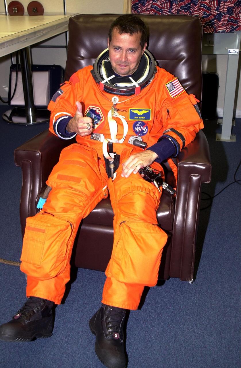 KENNEDY SPACE CENTER, Fla. -- Expedition 4 crew member Daniel W. Bursch gives a thumbs up for a successful second launch attempt of Space Shuttle Endeavour. The first attempt Dec. 4 was scrubbed due to poor weather conditions at KSC. The main goals of the mission are to carry the Expedition 4 crew to the International Space Station as replacement for Expedition 3; carry the Multi-Purpose Logistics Module Raffaello filled with water, equipment and supplies; and install thermal blankets over equipment at the base of the ISS solar wings. STS-108 is the final Shuttle mission of 2001 and the 107th Shuttle flight overall. It is the 12th flight to the Space Station. Launch is scheduled for 5:19 p.m. EST (22:19 GMT) Dec. 5, 2001, from Launch Pad 39B