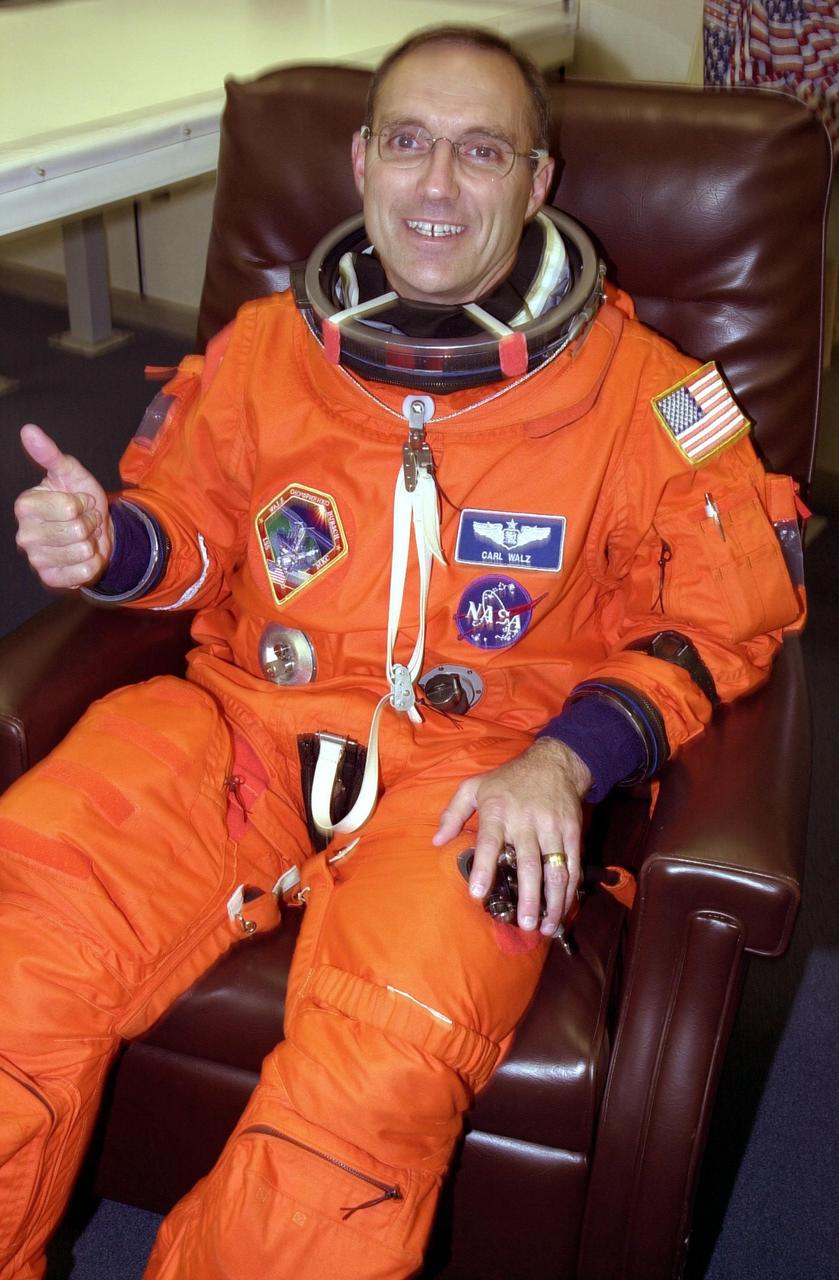 KENNEDY SPACE CENTER, Fla. -- Expedition 4 crew member Carl E. Walz gives thumbs up for a successful second launch attempt of Space Shuttle Endeavour. The first attempt Dec. 4 was scrubbed due to poor weather conditions at KSC. The main goals of the mission are to carry the Expedition 4 crew to the International Space Station as replacement for Expedition 3; carry the Multi-Purpose Logistics Module Raffaello filled with water, equipment and supplies; and install thermal blankets over equipment at the base of the ISS solar wings. STS-108 is the final Shuttle mission of 2001 and the 107th Shuttle flight overall. It is the 12th flight to the Space Station. Launch is scheduled for 5:19 p.m. EST (22:19 GMT) Dec. 5, 2001, from Launch Pad 39B