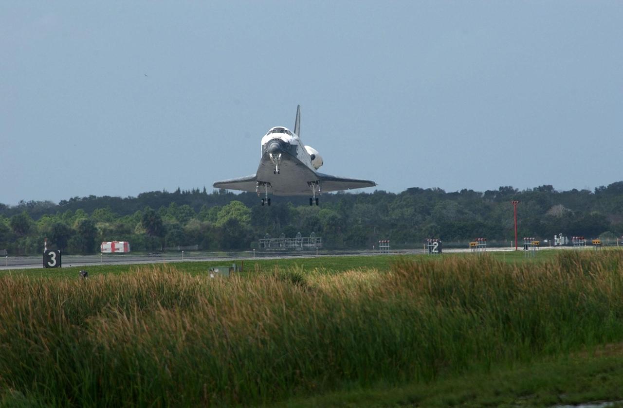 KENNEDY SPACE CENTER, FLA. --  Orbiter Endeavour approaches Runway 15 at the KSC Shuttle Landing Facility, after a mission elapsed time of 11 days, 19 hours, 35 minutes.  Main gear touchdown occurred at 12:55:10 p.m. EST, nose gear touchdown at 12:55:23 p.m. , wheel stop at 12:56:13 p.m.  The landing, the 57th at KSC in the history of the program, completed the STS-108 mission known as Utilization Flight 1, which was the 12th mission to the International Space Station.  This mission was the 107th flight in the Shuttle program and the 17th flight for the orbiter.  Endeavour carries both the mission crew and the Expedition 3 crew - Commander Frank Culbertson and cosmonauts Vladimir Dezhurov and Mikhail Tyurin - who are returning to Earth after 129 days in space on the Space Station