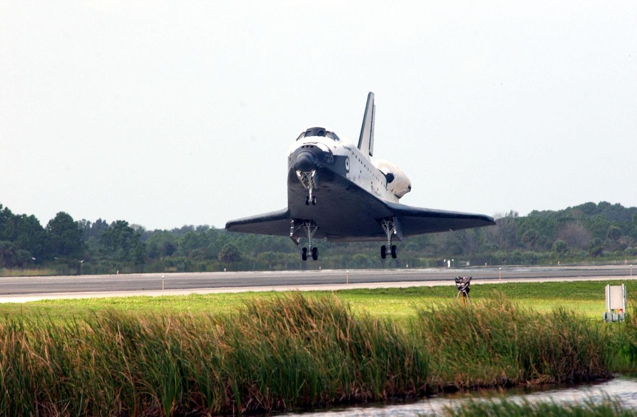 KENNEDY SPACE CENTER, FLA. -- Orbiter Endeavour approaches touchdown on Runway 15 at the KSC Shuttle Landing Facility, completing mission STS-108.  After a mission-elapsed time of 11 days, 19 hours and 35 minutes, the landing is the 57th at KSC in the history of the program. Main gear touchdown occurred at 12:55:10 p.m. EST (17:55:10 GMT), nose gear touchdown at 12:55:23 p.m. (17:55:23 GMT) , wheel stop at 12:56:13 p.m. (17:56:13 GMT).   STS-108 was the 12th mission to the International Space Station.  This mission was the 107th flight in the Shuttle program and the 17th flight for the orbiter. Endeavour carries both the mission crew and the Expedition 3 crew - Commander Frank Culbertson and cosmonauts Vladimir Dezhurov and Mikhail Tyurin - who are returning to Earth after 129 days in space on the Space Station