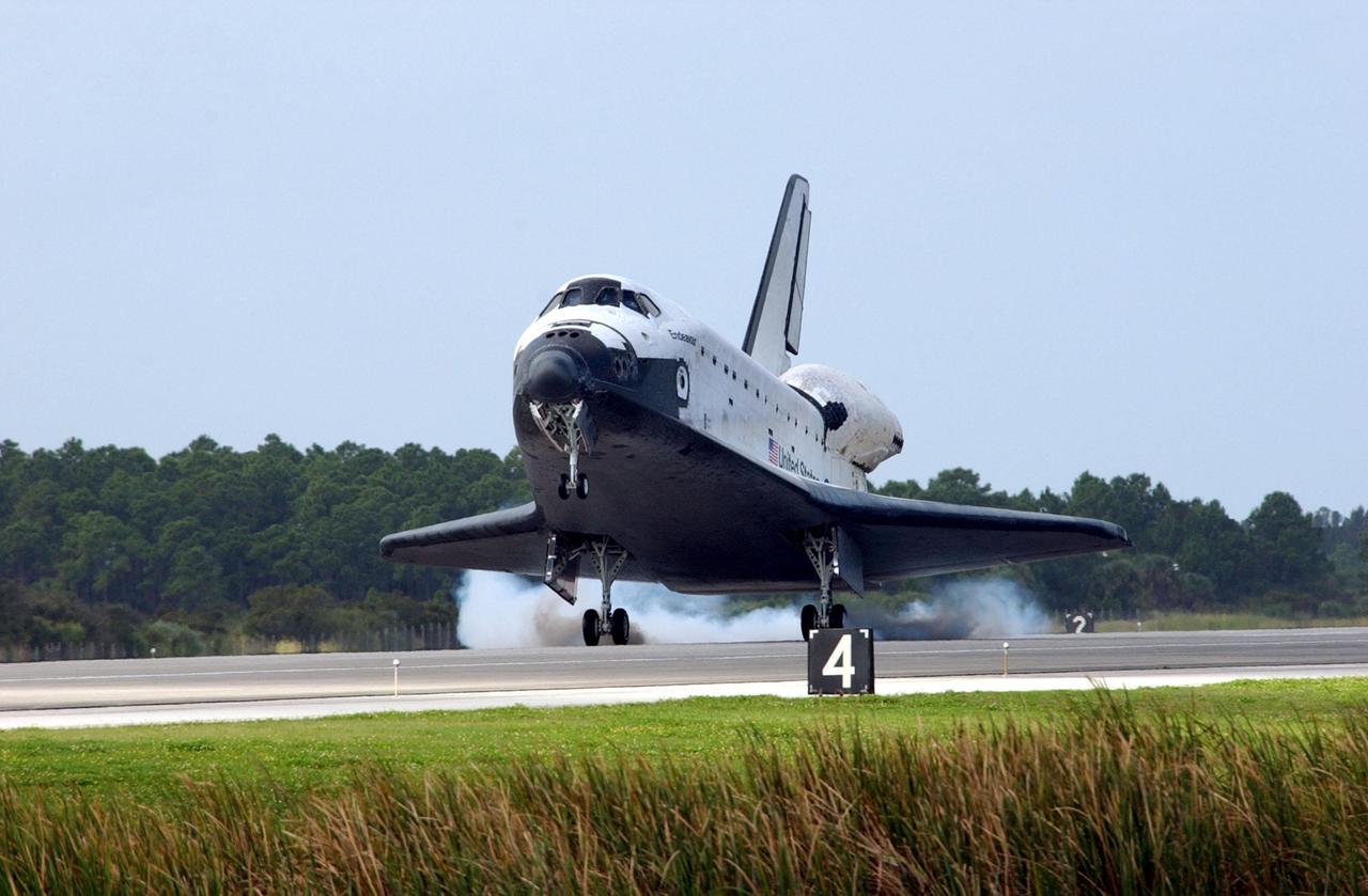 KENNEDY SPACE CENTER, FLA. - Orbiter Endeavour kicks up dust as it touches down on Runway 15 at the KSC Shuttle Landing Facility, completing mission STS-108.  After a mission-elapsed time of 11 days, 19 hours and 35 minutes, the landing is the 57th at KSC in the history of the program. Main gear touchdown occurred at 12:55:10 p.m. EST (17:55:10 GMT), nose gear touchdown at 12:55:23 p.m. (17:55:23 GMT) , wheel stop at 12:56:13 p.m. (17:56:13 GMT).   STS-108 was the 12th mission to the International Space Station.  This mission was the 107th flight in the Shuttle program and the 17th flight for the orbiter. Endeavour carries both the mission crew and the Expedition 3 crew - Commander Frank Culbertson and cosmonauts Vladimir Dezhurov and Mikhail Tyurin - who are returning to Earth after 129 days in space on the Space Station