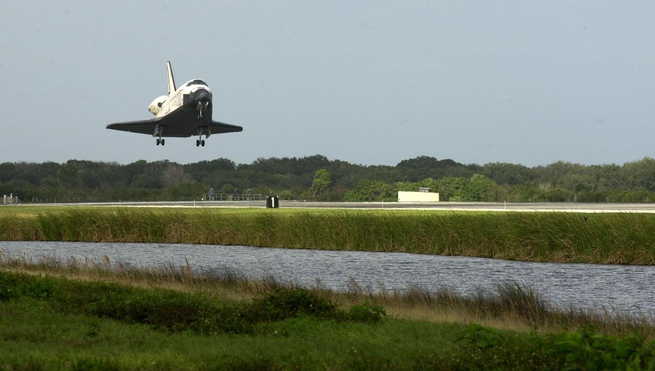 KENNEDY SPACE CENTER, FLA. -- Orbiter Endeavour glides toward touchdown on Runway 15 at the KSC Shuttle Landing Facility, completing mission STS-108.  After a mission-elapsed time of 11 days, 19 hours and 35 minutes, the landing is the 57th at KSC in the history of the program. Main gear touchdown occurred at 12:55:10 p.m. EST (17:55:10 GMT), nose gear touchdown at 12:55:23 p.m. (17:55:23 GMT) , wheel stop at 12:56:13 p.m. (17:56:13 GMT).   STS-108 was the 12th mission to the International Space Station.  This mission was the 107th flight in the Shuttle program and the 17th flight for the orbiter. Endeavour carries both the mission crew and the Expedition 3 crew - Commander Frank Culbertson and cosmonauts Vladimir Dezhurov and Mikhail Tyurin - who are returning to Earth after 129 days in space on the Space Station