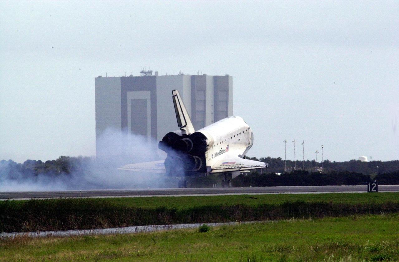 KENNEDY SPACE CENTER, FLA. - Dust streams behind orbiter Endeavour as it touches down on Runway 15 at the Shuttle Landing Facility, completing mission STS-108 after a mission-elapsed time of 11 days, 19 hours and 35 minutes.  The landing is the 57th at KSC in the history of the program. Main gear touchdown occurred at 12:55:10 p.m. EST (17:55:10 GMT), nose gear touchdown at 12:55:23 p.m. (17:55:23 GMT) , wheel stop at 12:56:13 p.m. (17:56:13 GMT).   STS-108 was the 12th mission to the International Space Station.  This mission was the 107th flight in the Shuttle program and the 17th flight for the orbiter. Endeavour carries both the mission crew and the Expedition 3 crew - Commander Frank Culbertson and cosmonauts Vladimir Dezhurov and Mikhail Tyurin - who are returning to Earth after 129 days in space on the Space Station