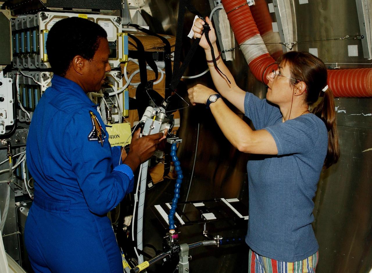 KENNEDY SPACE CENTER, FLA. -- At SPACEHAB in Cape Canaveral, Fla., STS-107 Payload Commander Michael Anderson gets experience on equipment for the mission. STS-107 is a research mission, and the primary payload is the first flight of the SHI Research Double Module (SHI/RDM). The experiments range from material sciences to life sciences (many rats).  Among the experiments is a Hitchhiker carrier system, modular and expandable in accordance with payload requirements.  STS-107 is scheduled to launch in June 2002