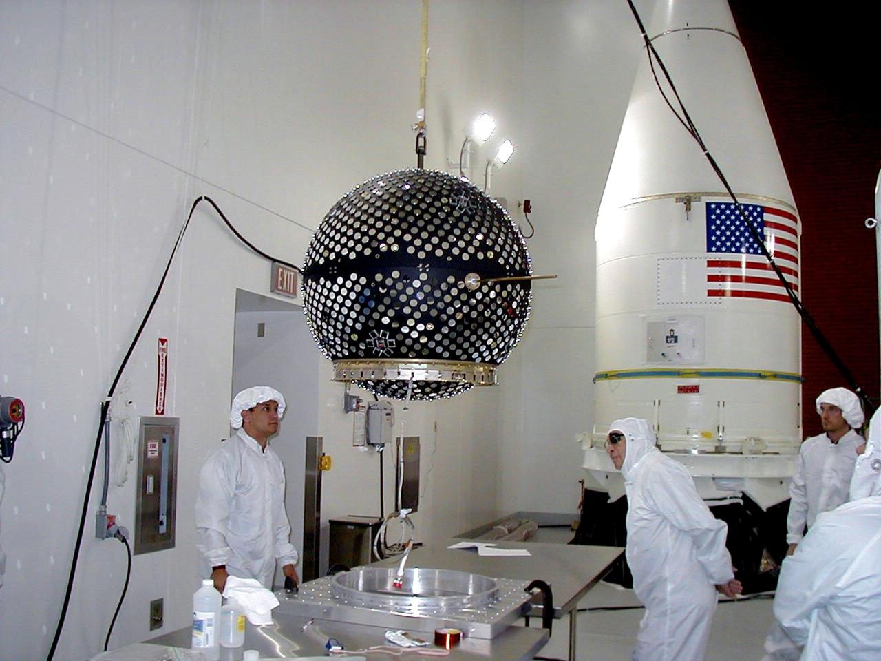 KODIAK ISLAND, Alaska -- Technicians prepare the Starshine 3 payload, while the payload fairing of the Athena 1 launch vehicle awaits servicing at Kodiak Island, Alaska, as preparations to launch Kodiak Star proceed. The first orbital launch to take place from Alaska's Kodiak Launch Complex, Kodiak Star is scheduled to lift off on a Lockheed Martin Athena I launch vehicle on Sept. 17 during a two-hour window that extends from 5:00 to 7:00 p.m. ADT. The payloads aboard include the Starshine 3, sponsored by NASA, and the PICOSat, PCSat and Sapphire, sponsored by the Department of Defense (DoD) Space Test Program