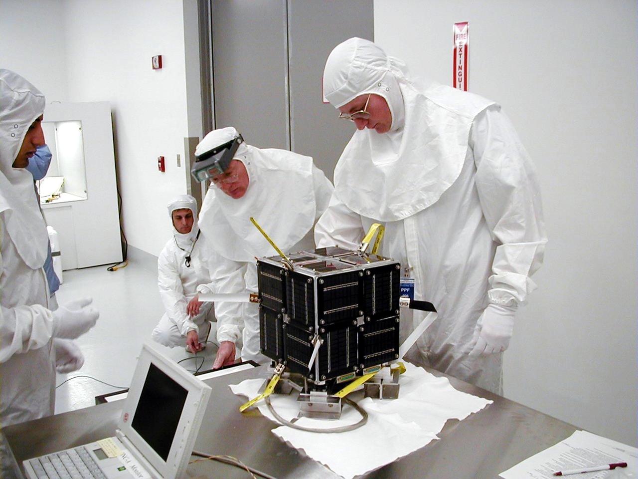 KODIAK ISLAND, Alaska -- Technicians prepare the PICSat payload for its launch aboard the Athena 1 launch vehicle at Kodiak Island, Alaska, as preparations to launch Kodiak Star proceed. The first orbital launch to take place from Alaska's Kodiak Launch Complex, Kodiak Star is scheduled to lift off on a Lockheed Martin Athena I launch vehicle on Sept. 17 during a two-hour window that extends from 5 p.m. to 7 p.m. p.m. ADT. The payloads aboard include the Starshine 3, sponsored by NASA, and the PICOSat, PCSat and Sapphire, sponsored by the Department of Defense (DoD) Space Test Program.