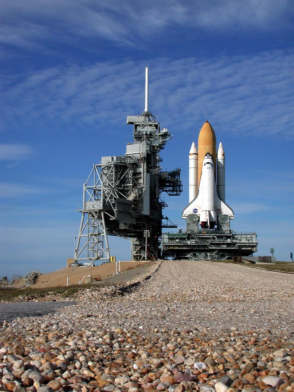KENNEDY SPACE CENTER, Fla. -- At the top of the incline to Launch Pad 39A, Space Shuttle Atlantis nears the Rotating Service Structure (left). Atlantis will fly on mission STS-98, the seventh construction flight to the International Space Station, carrying the U.S. Laboratory, named Destiny. The lab will have five system racks already installed inside the module. After delivery of electronics in the lab, electrically powered attitude control for Control Moment Gyroscopes will be activated. Atlantis is scheduled for launch no earlier than Jan. 19, 2001, with a crew of five