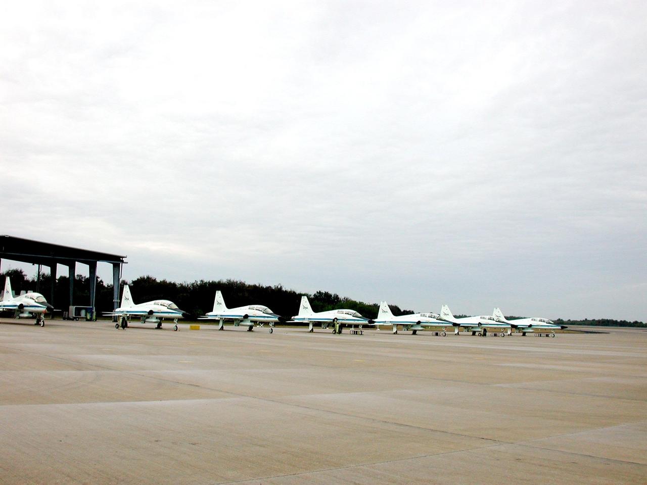 KENNEDY SPACE CENTER, FLA. -- At the Shuttle Landing Facility, T-38 jet training aircraft are lined up on the parking apron. T-38s are typically used by astronauts to travel between Johnson Space Center, Houston, and Kennedy Space Center. The STS-98 crew recently arrived aboard the jets to prepare for their launch Feb. 7 to the International Space Station. The seventh construction flight to the Space Station, it will carry the U.S. Laboratory Destiny, a key module for space experiments