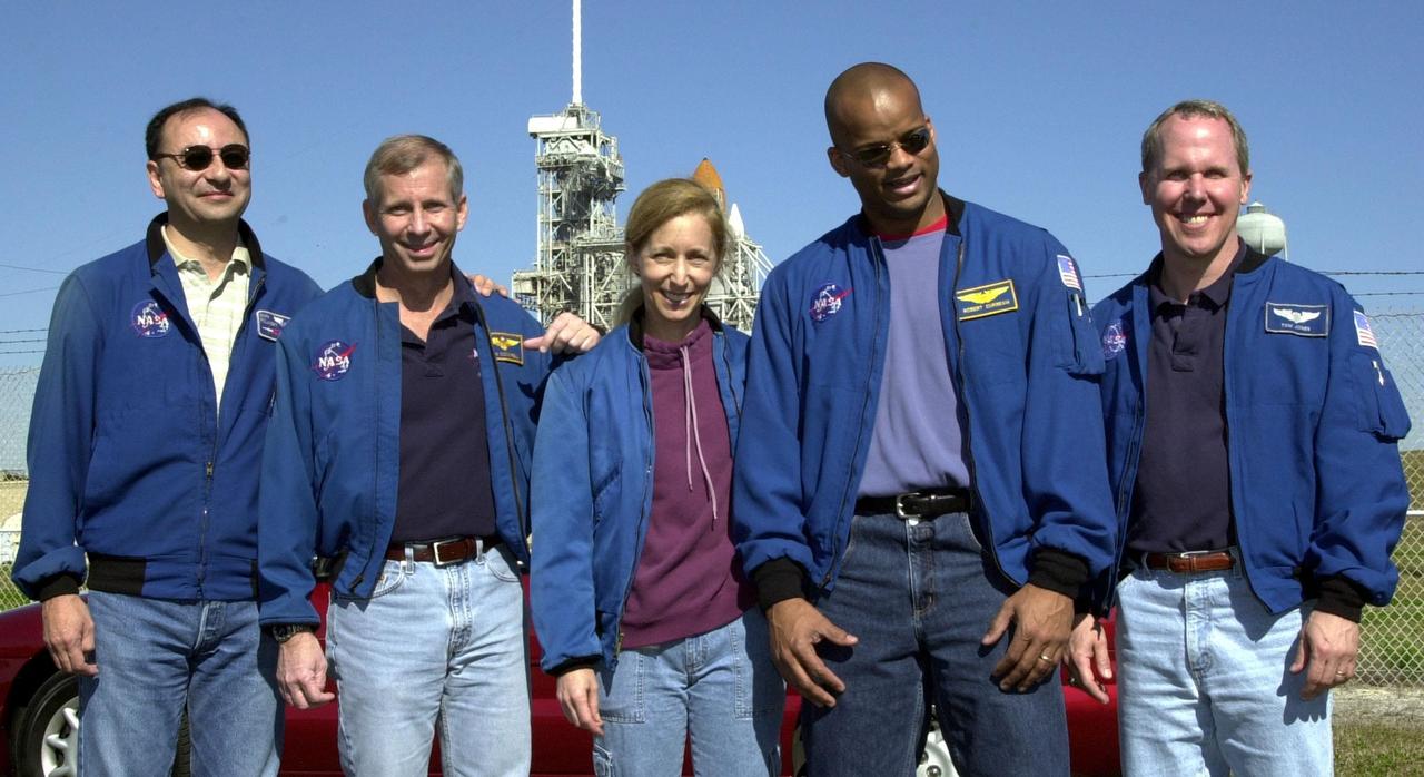 A happy and relaxed STS-98 crew pause for a photo at Launch Pad 39A one day before launch. From left, they are Pilot Mark Polansky, Commander Ken Cockrell and Mission Specialists Marsha Ivins, Robert Curbeam and Thomas Jones. Behind them is Space Shuttle Atlantis, poised for launch.This mission marks the seventh Shuttle flight to the International Space Station and the first Shuttle mission of the year. On the mission, the crew will deliver the U.S. Laboratory Destiny to the growing Space Station. Destiny will be attached to the Unity node using the Shuttle’s robotic arm. Three spacewalks are required to complete the planned construction work. The 11-day STS-98 mission is scheduled to launch Feb. 7 at 6:11 p.m. EST, with a planned KSC landing about 1:39 p.m. on Feb. 18