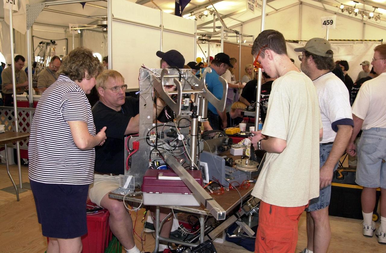 Students and their mentors prepare their team robot to compete in the NASA/KSC FIRST Southeastern Regional event.  FIRST (For Inspiration and Recognition of Science and Technology) events are held nationwide, pitting the student-built robots against each other and the clock on a playing field.   Many teams are sponsored by corporations and academic institutions.  There are 27 teams throughout the State of Florida who are competing.  KSC, which sponsors nine teams, has held the regional event for two years.
